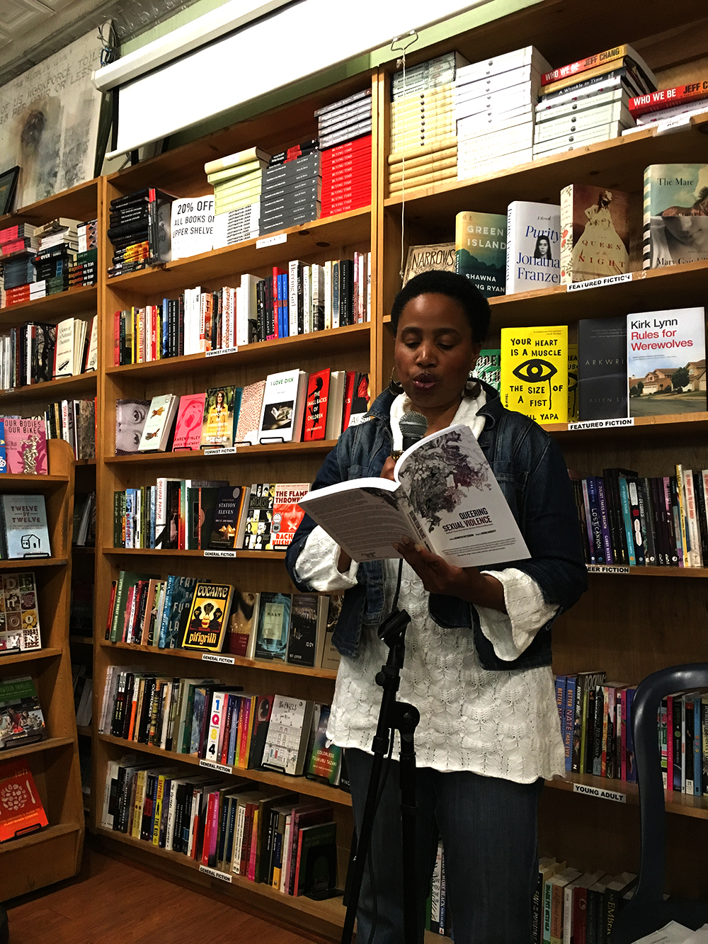 Aishah Shahidah Simmons reading from her chapter “Removing the Mask: AfroLez®femcentric Silence Breaker” in Queering Sexual Violence: Radical Voices from Within the Anti-Violence Movement (Jennifer Patterson, editor) at Bluestockings Bookstore © 2016