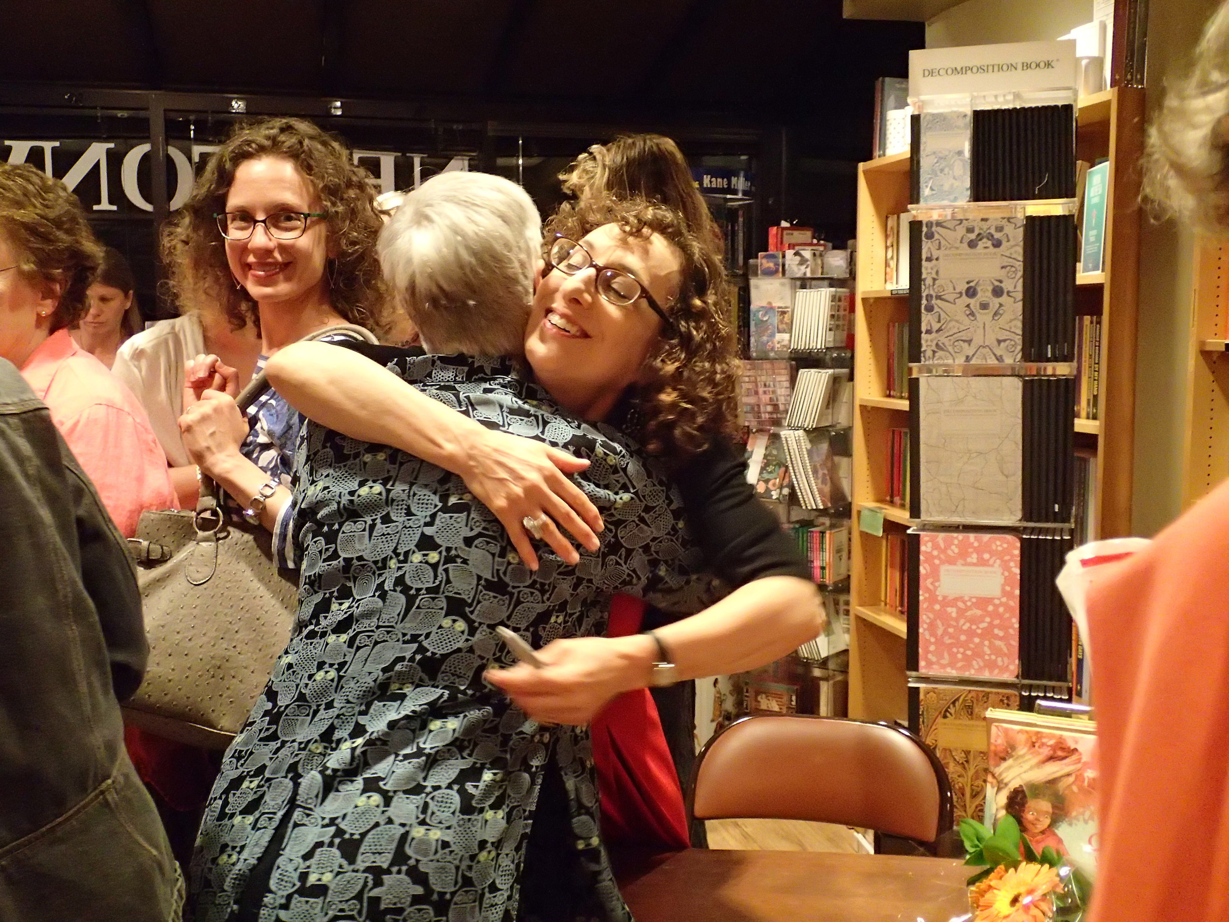 Happy hug from Carol, while Holly looks on.