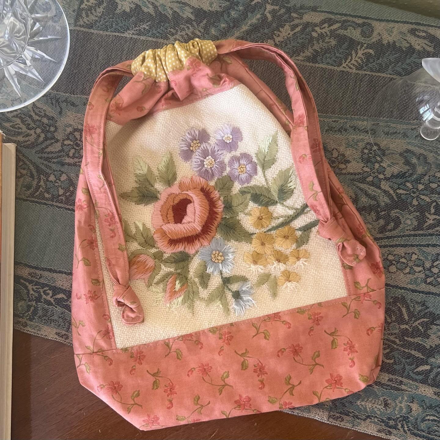 Upcycling- A forgotten hand embroidered cushion my mom made decades ago. I used the center and turned it into a delicate drawstring bag. #upcycling #repurposed #embroideredflowers #drawstringbag