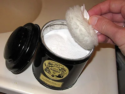 Baking soda deodorant instead of commercial deodorant in a plastic container.