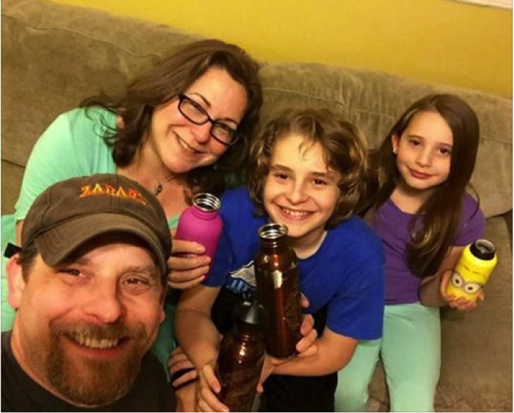 The Mogel family shows off their reusable bottles