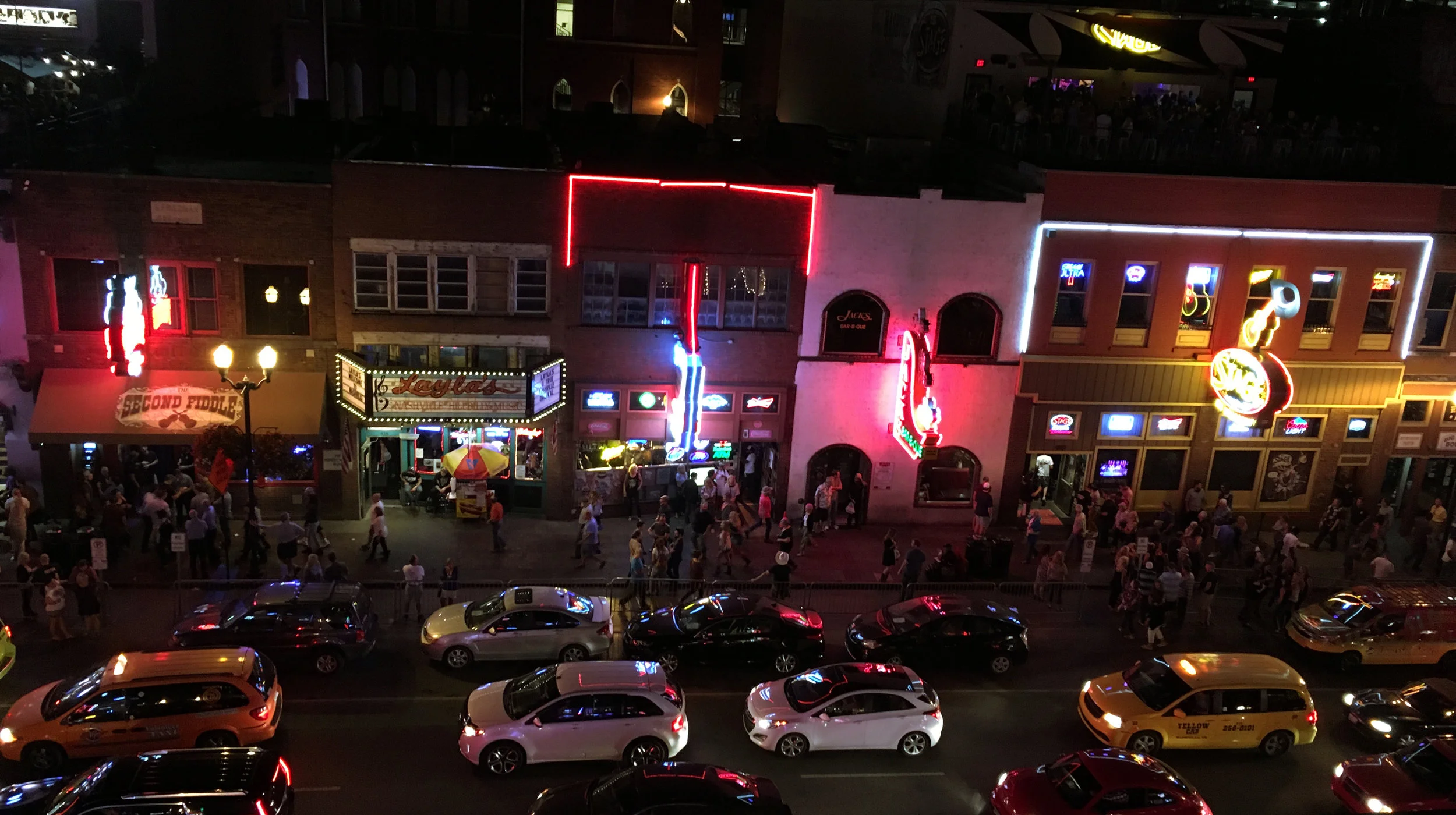 The view of Lower Broadway in Nashville, TN from the 4th floor rooftop at Alan Jackson's Good Time Bar on Thursday, September 27th, 2017. Groups of tourists were window shopping the bands and crowds inside the honky-tonks on the north side of the st…
