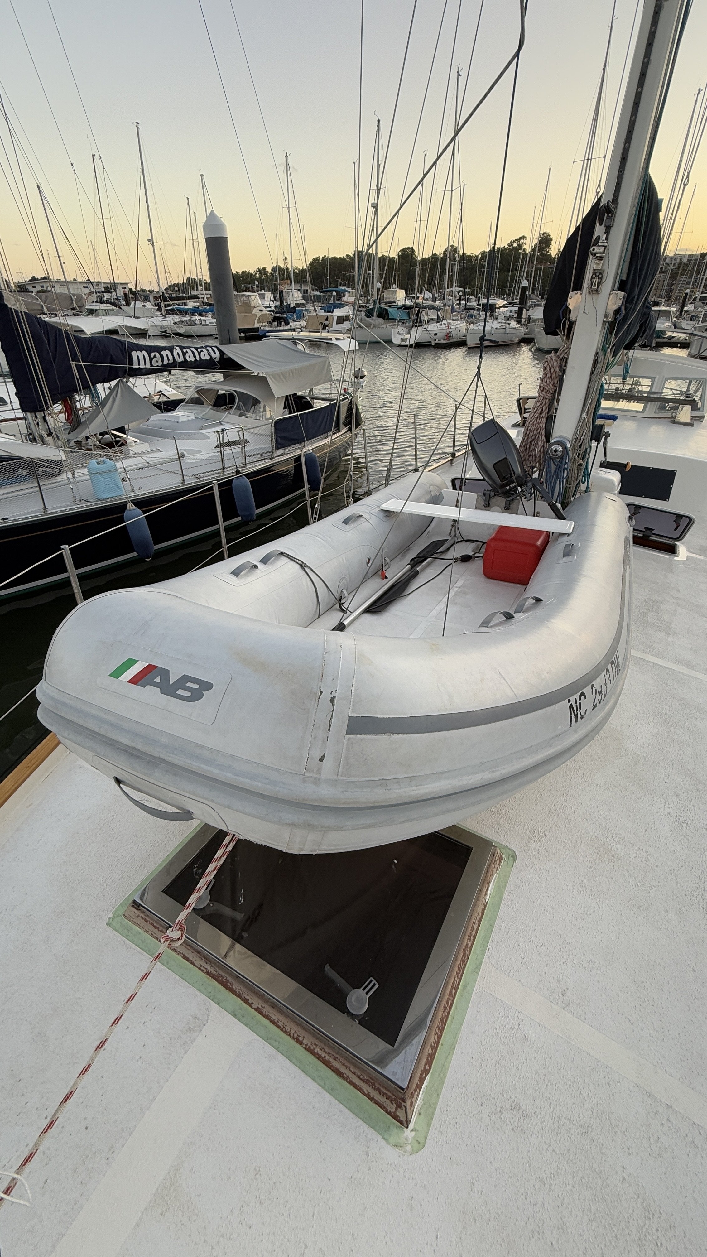 Inflatable boat on yacht deck at a marina