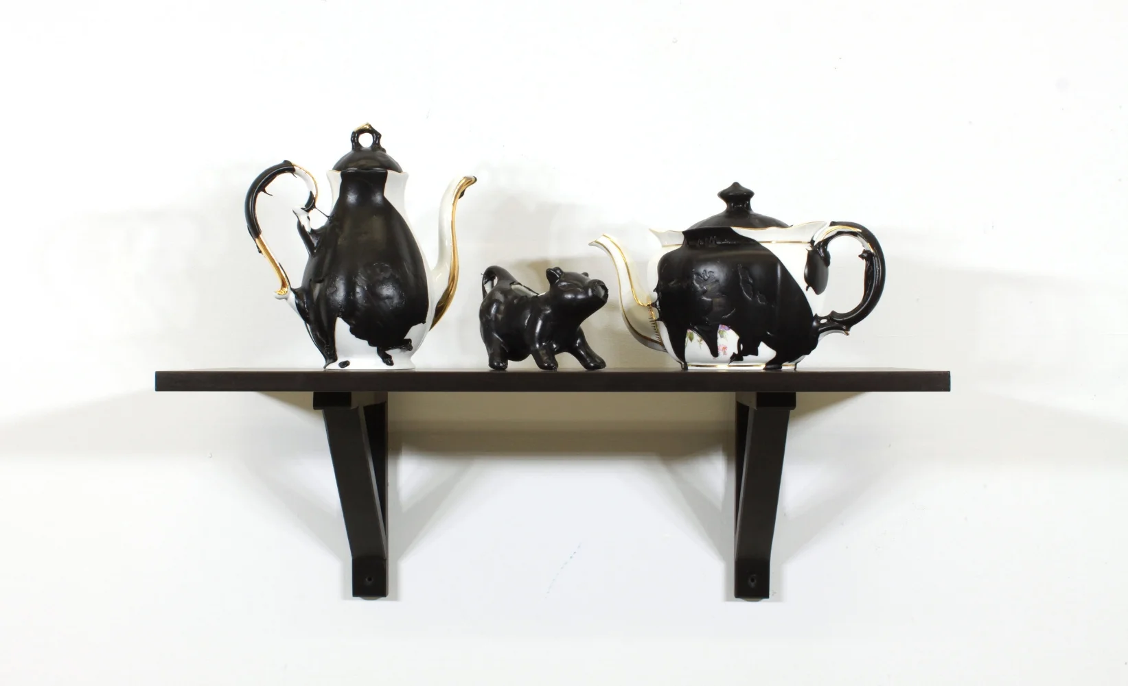 Detail of Man-Cave 2 (Tea Set 2) , 2017 Found china, Plasti Dip, shelf Self is approximately 23” x 10” x 10”