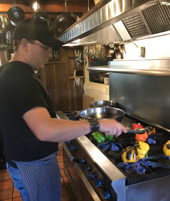 Roasting peppers in kitchen at Mabel Dodge Luhan
