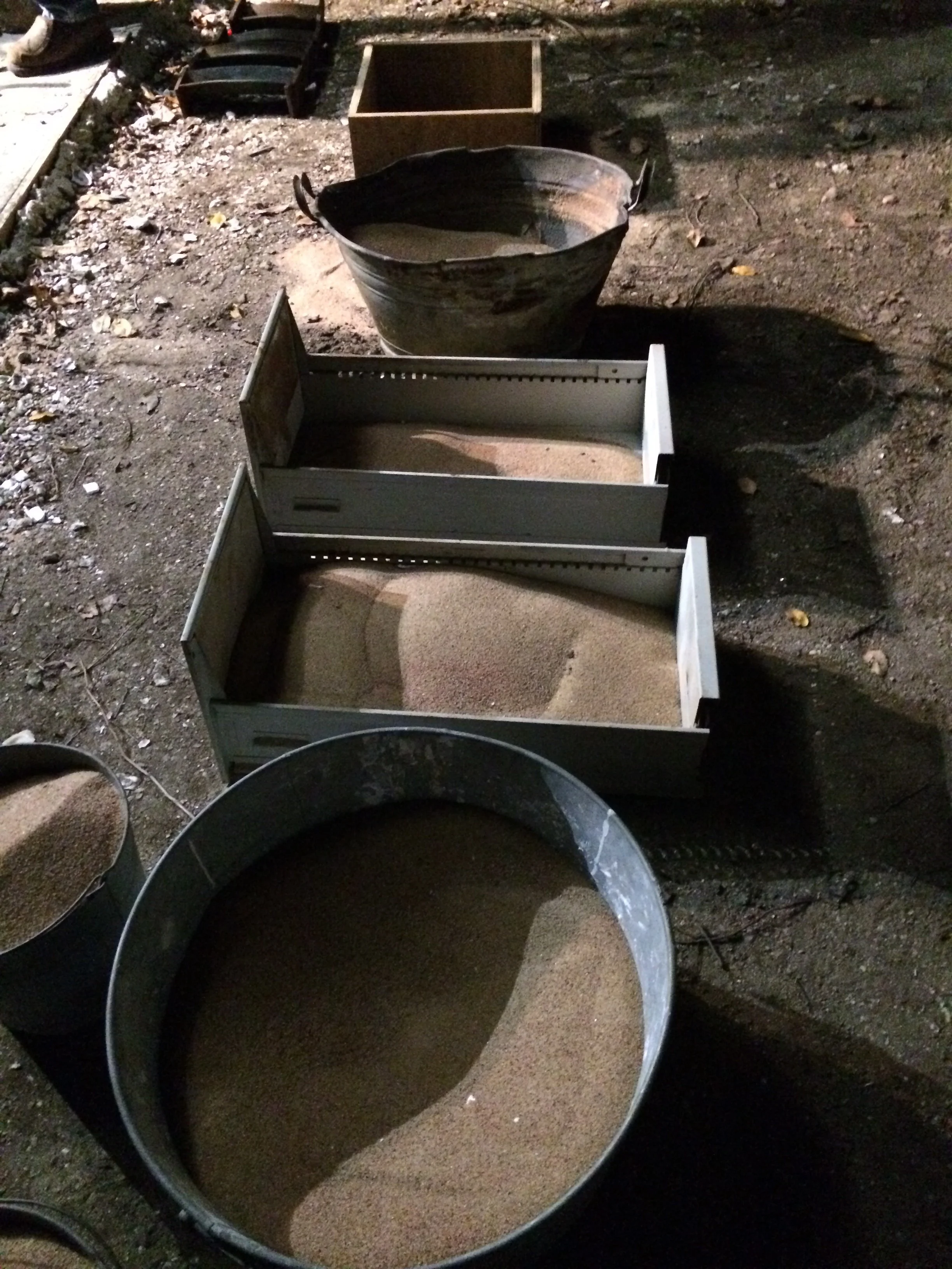 Buckets of sand that will hold the shells when we pour in the bronze.
