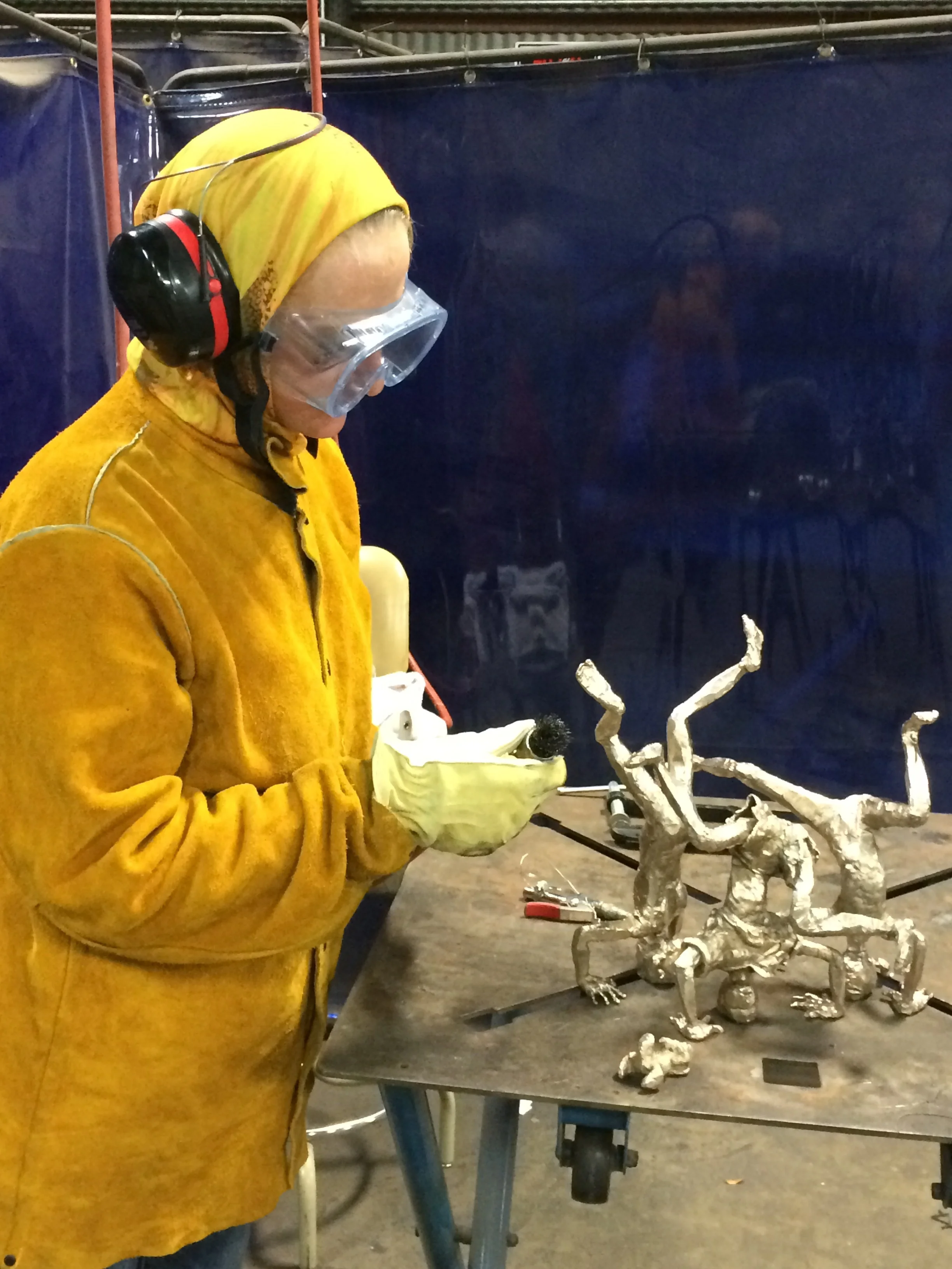 Using a pneumatic with a metal brush then 3m polishing wheels.