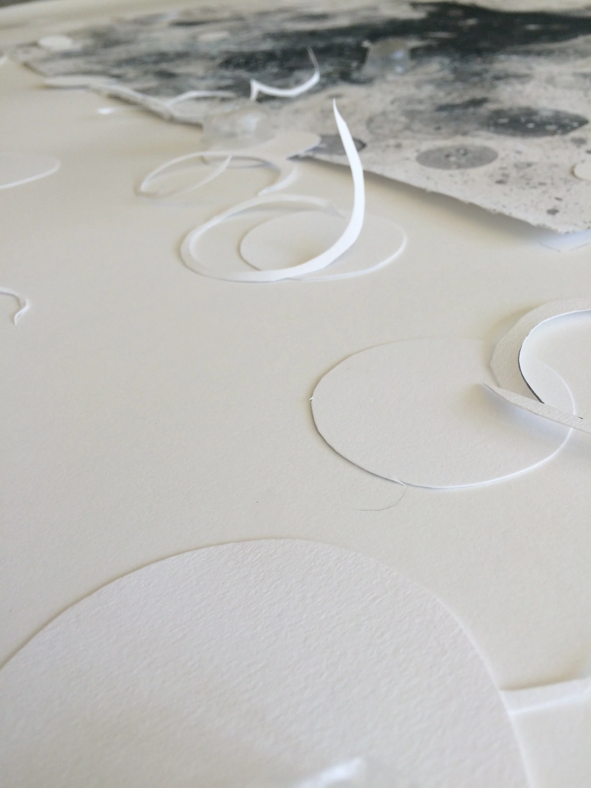 The large Stonehenge is not as white as the 30" X 22" stonehenge I did the drawings on. In order to integrate the two colors of white I collaged large circles of each color of Stonehenge on both the drawing and new paper. I think the two colors is gong to be great. 