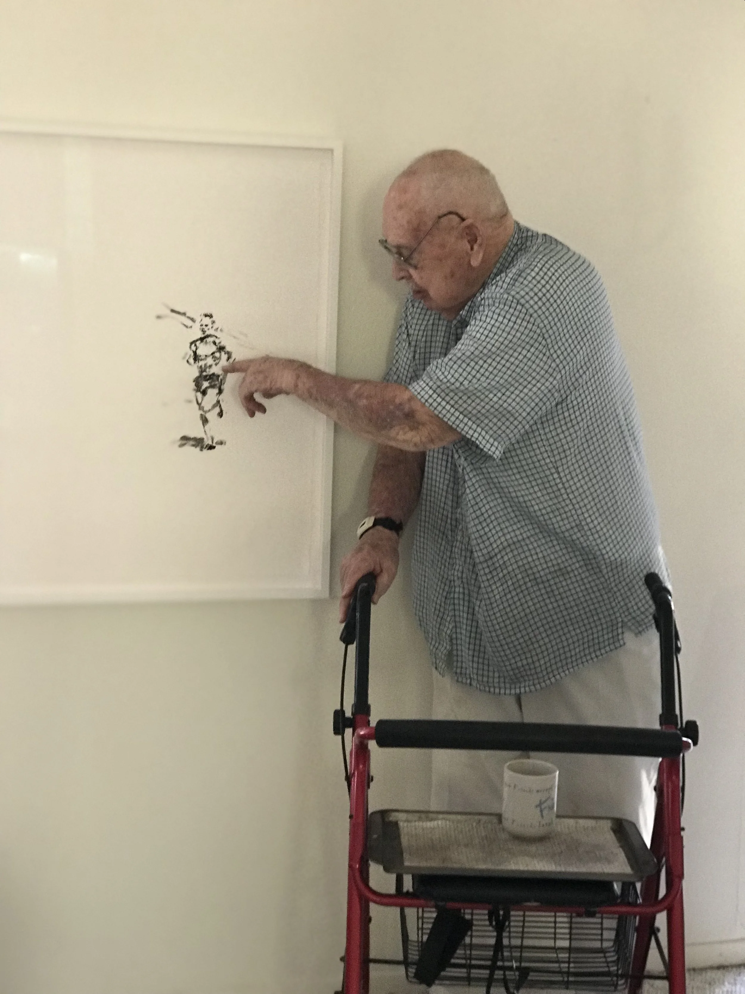 On my Dad’s birthday- my dad with a drawing I made of him from an old newspaper clipping of him running track. 