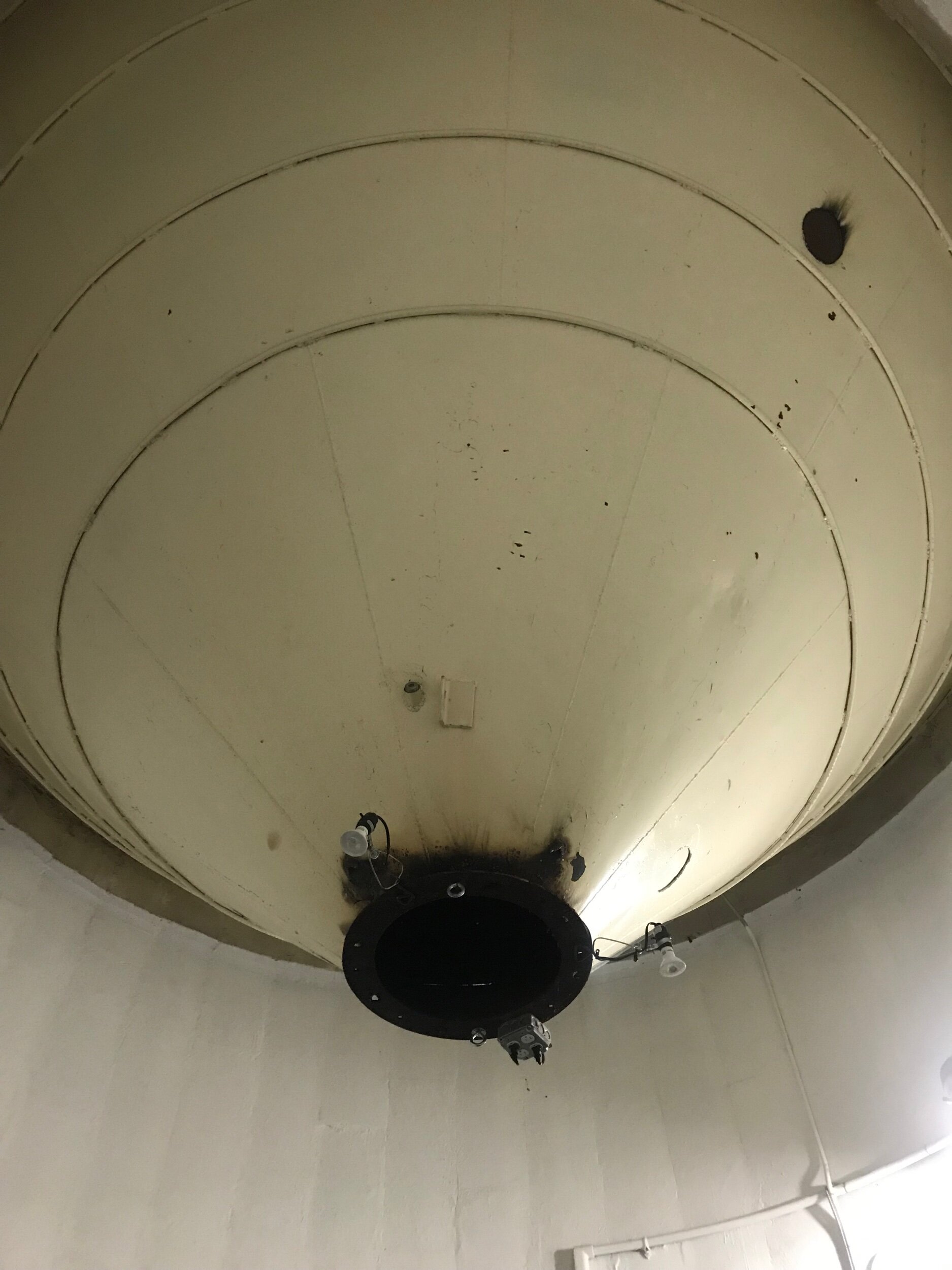 Can you imagine how many tons of rice dropped through this funnel? The gallery lighting is attached to the mouth. It is right in the center of the space. I am not sure I like the central placement.
