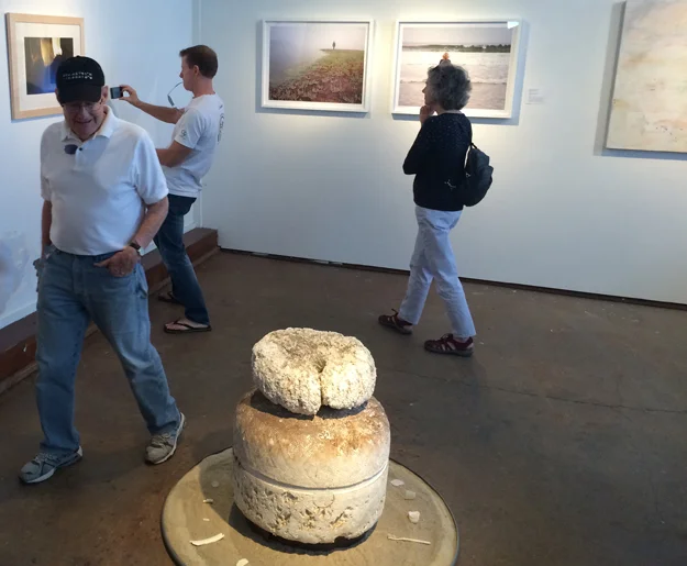 Pictured in foreground Omphalos , a sculpture of found objects and sand from Kehoe Beach by artist Judith Selby Lang. Photograph by Chris Reding on the left.