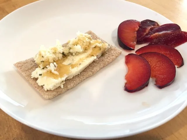 Snack! Herbed paneer on flatbread with honey, and plum slices on the side.