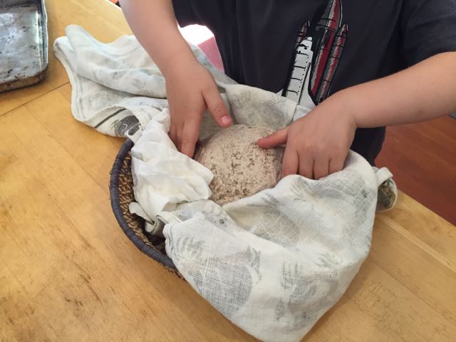 Wyatt woke up the bread to put it in the oven.