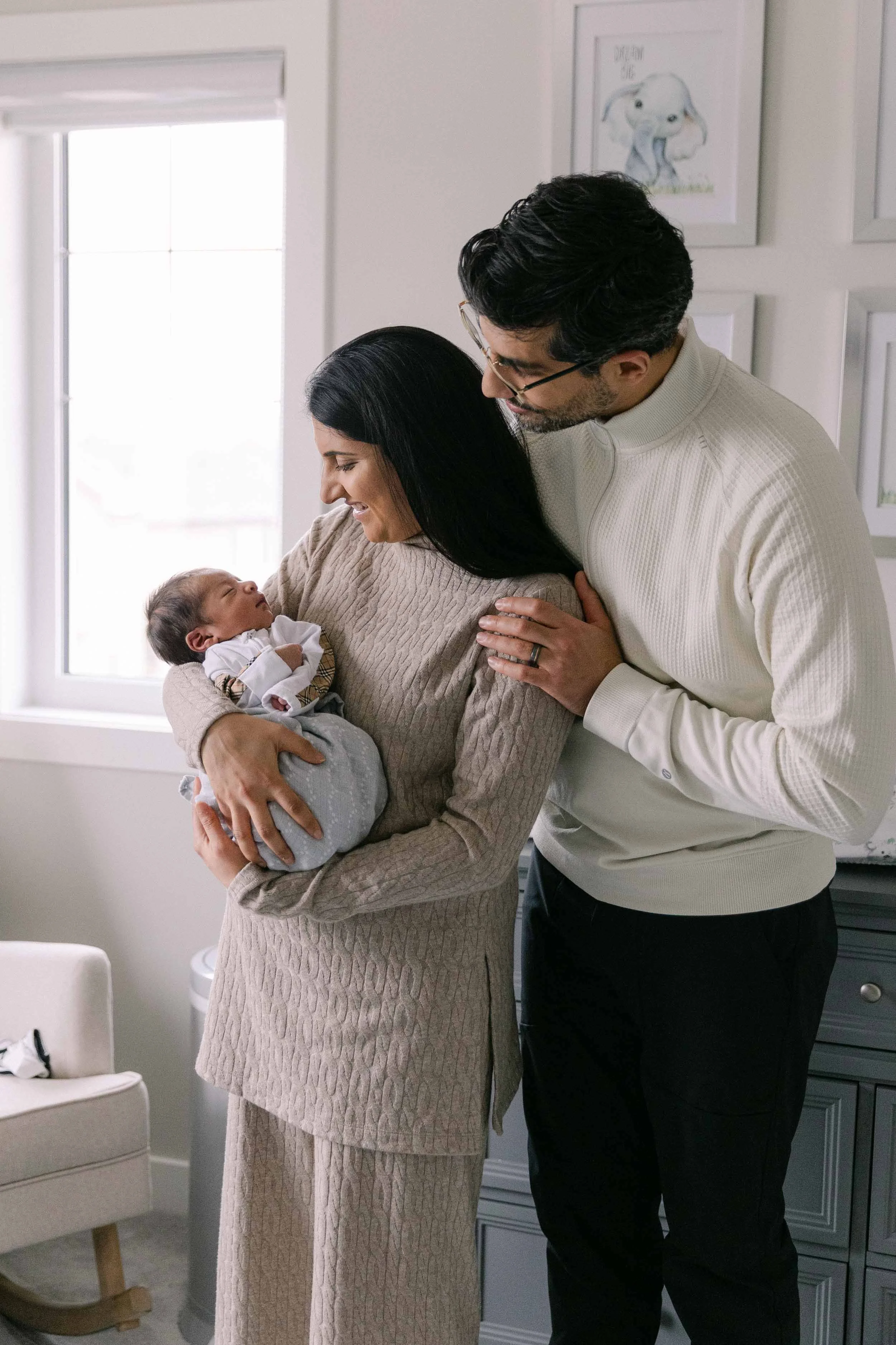 Lifestyle newborn session in tan, cream and black neutrals, indian family