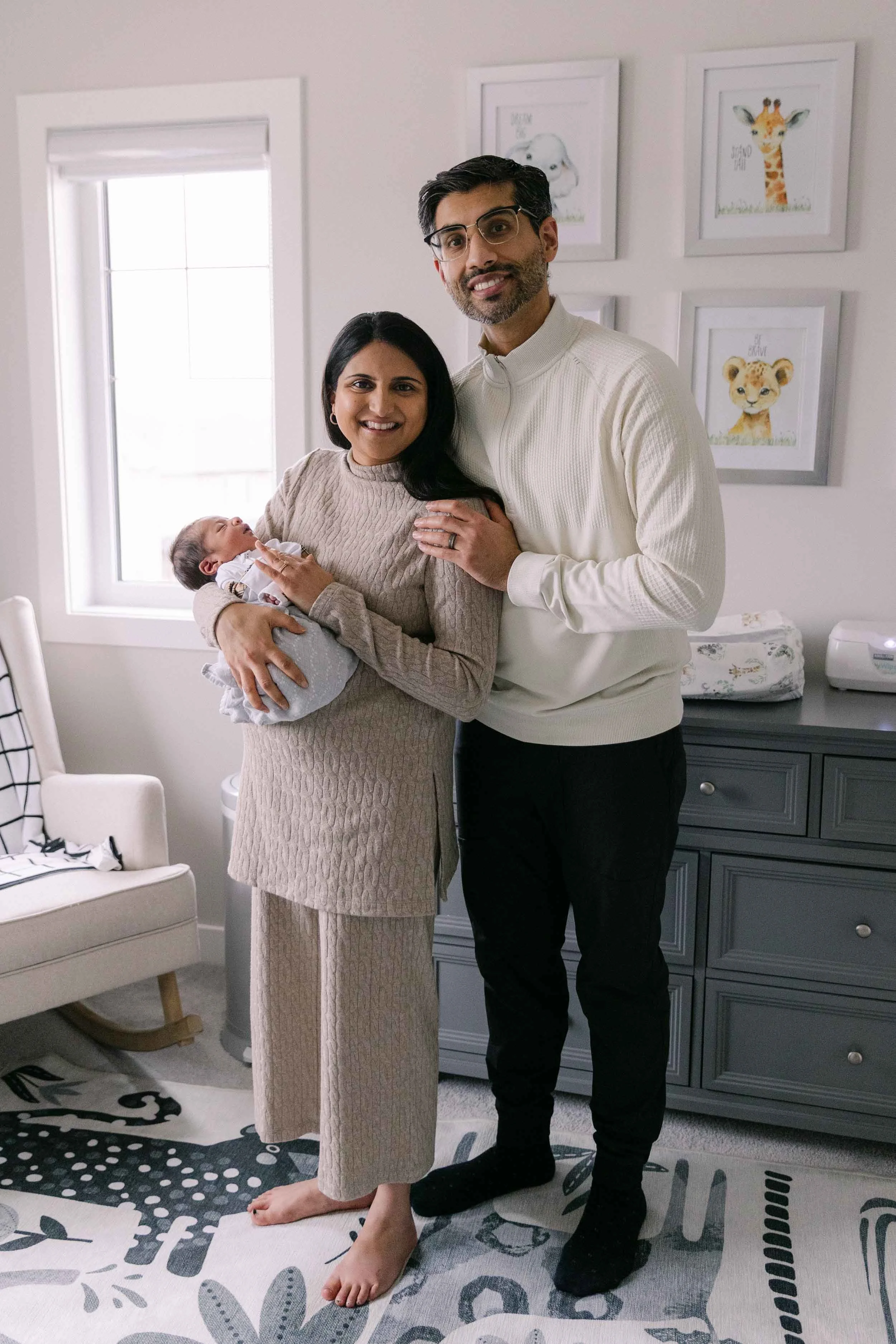 Lifestyle newborn session in tan, cream and black neutrals, indian family