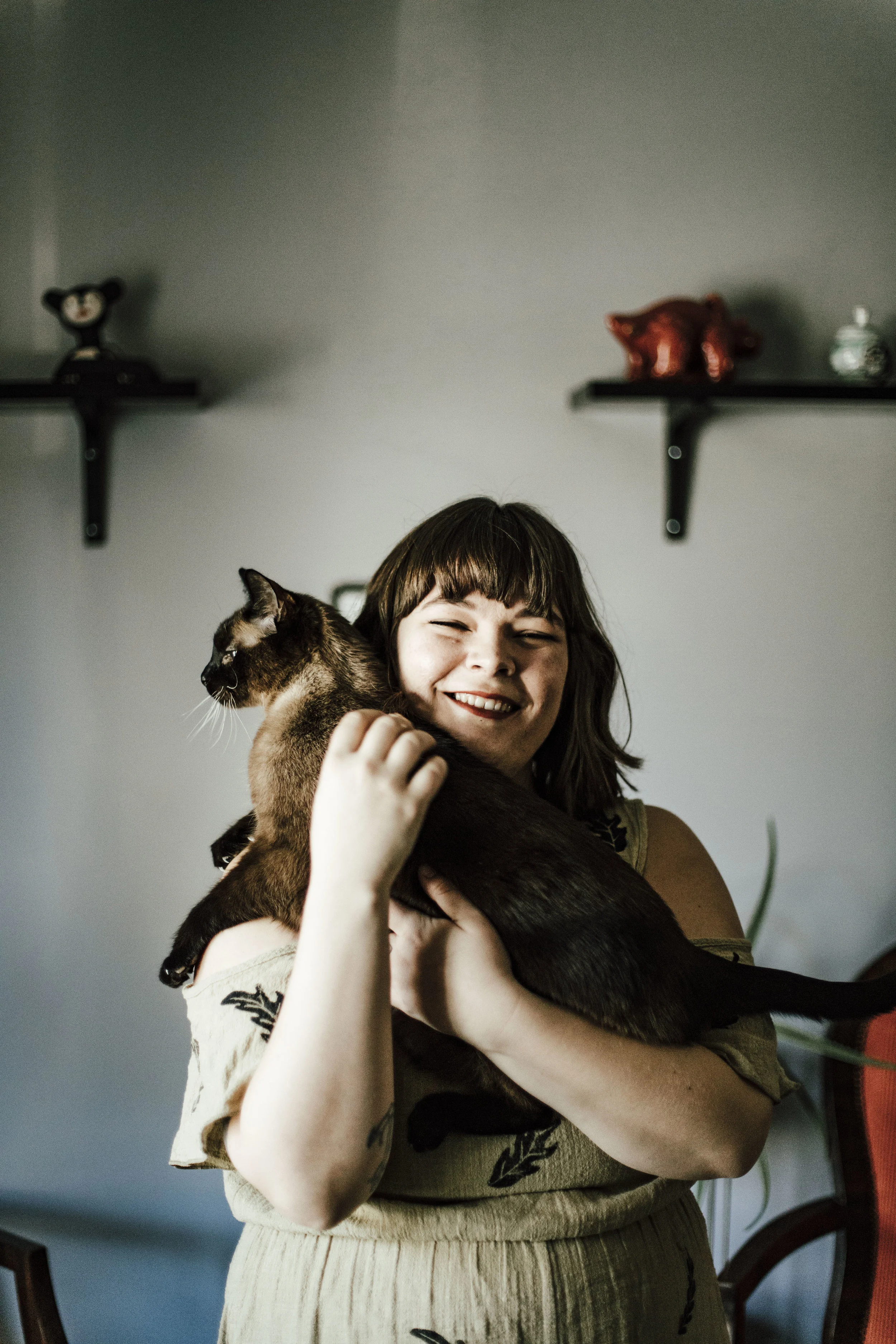 Photograph of the artist with her cat, Max by Juliana Noelle Photography .