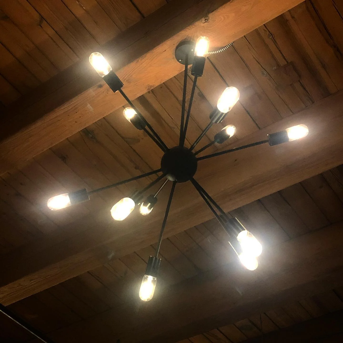 One of the lights that I was able to salvage. It looks beautiful against our timber ceilings.