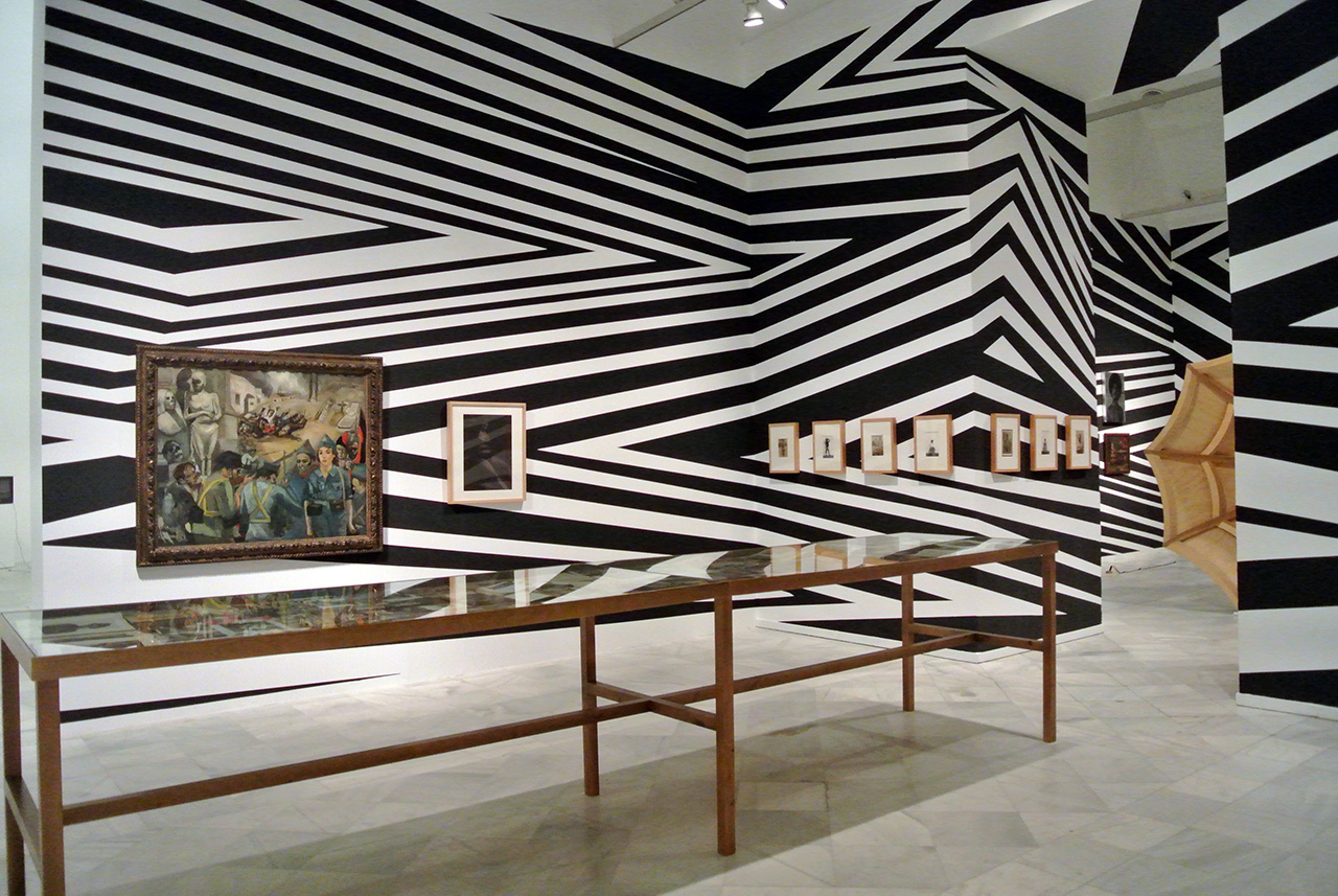 Wood, paper, glass, archival materials. Archival collections from the artist, including Anatomy of a body record: beyond Tasmania and 52 portraits , 2013; Museo Reina Sofia, Museo de América and Museo Nacional de Antropología. Installation view A Solid Memory of the Forgotten Plains of our Trash and Obsessions Part of Really Useful Knowledge exhibition, at Museo Reina Sofia, Madrid October 29, 2014 - February 9, 2015