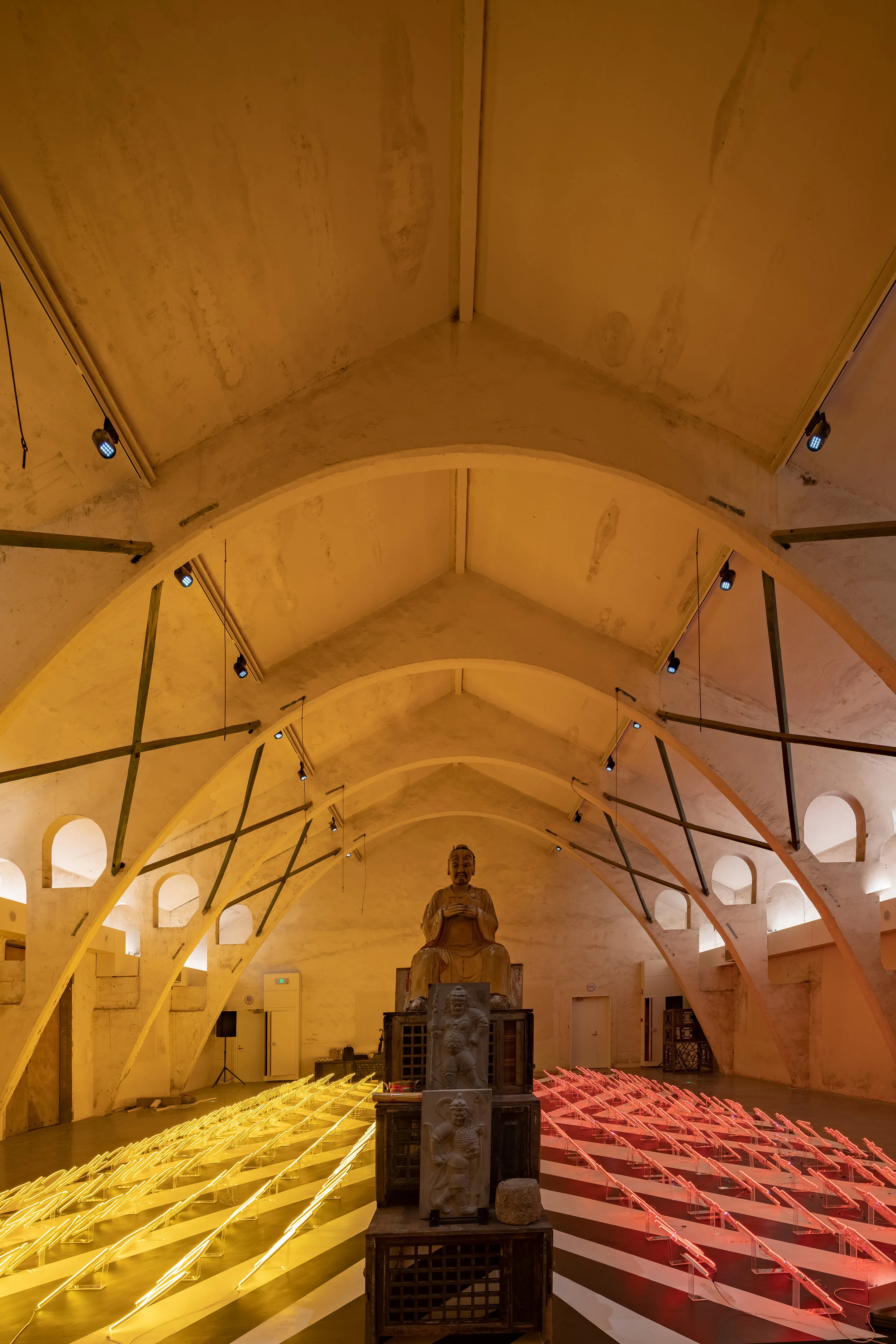 In Vision of Nuance: Systems of Exposure , 2019 site-specific installation for The time is now: 2019 , WuZhen, China Dimensions variable neon elements, original and replica of First Nations, Chinese and Western artefacts, traditional wood cabinets from Wuzhen, floor painting and audio soundtrack photo credit: @Art Wuzhen