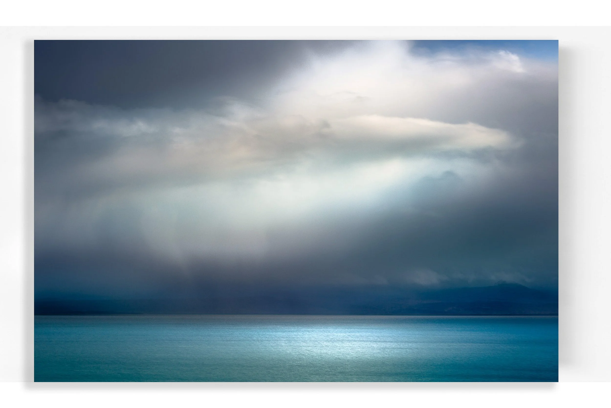 art with glowing white cloud in blue and teal tones