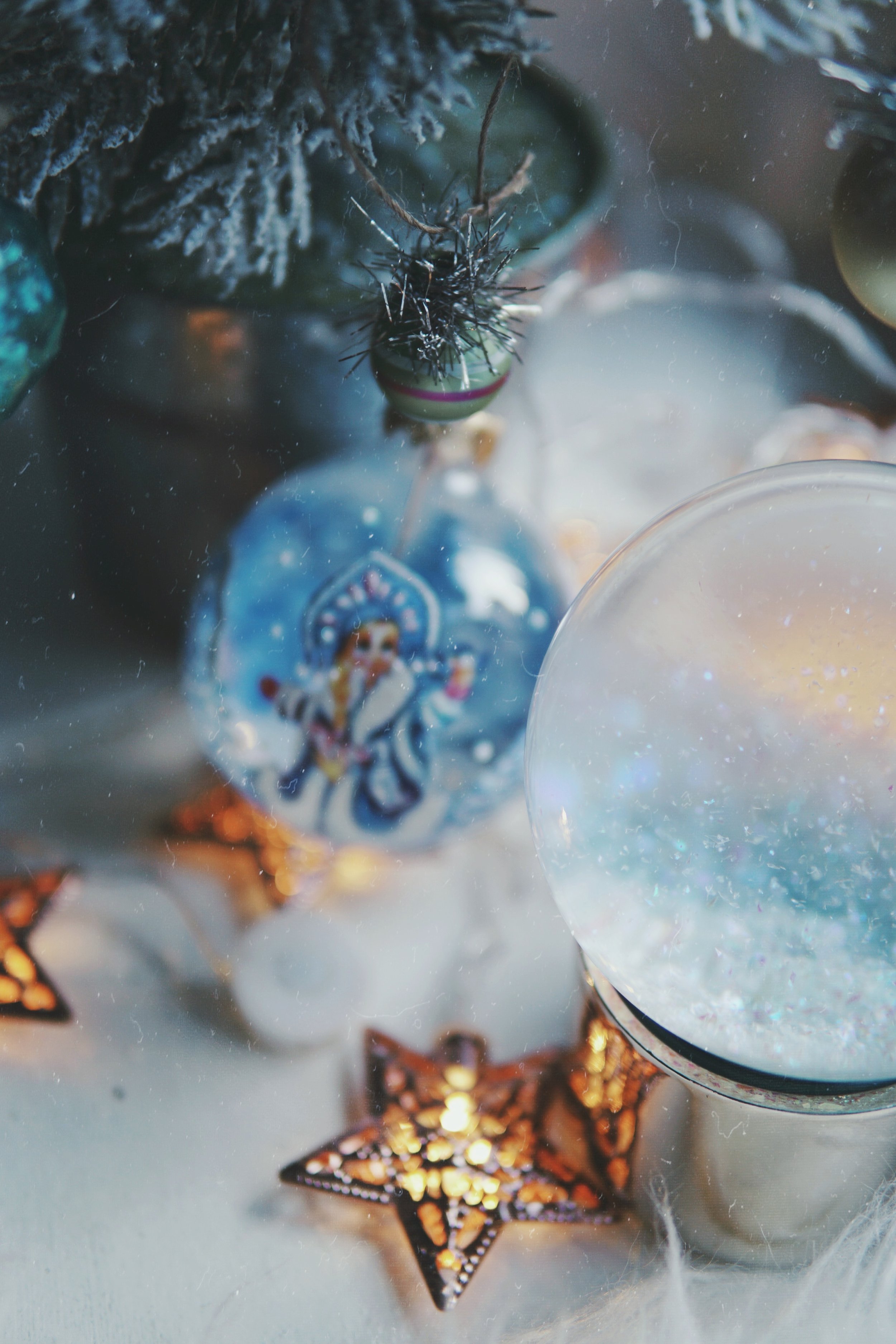 tree: terrain | ornaments: anthropologie | snowglobe: urban outfitters | starry lights: urban outfitters | snegurochka ornament: net cost market