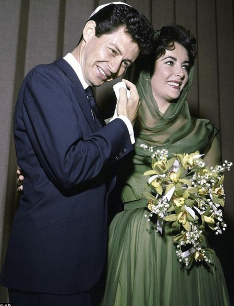  Elizabeth Taylor dressed in sophisticated sage with yellow-white-sage bouquet