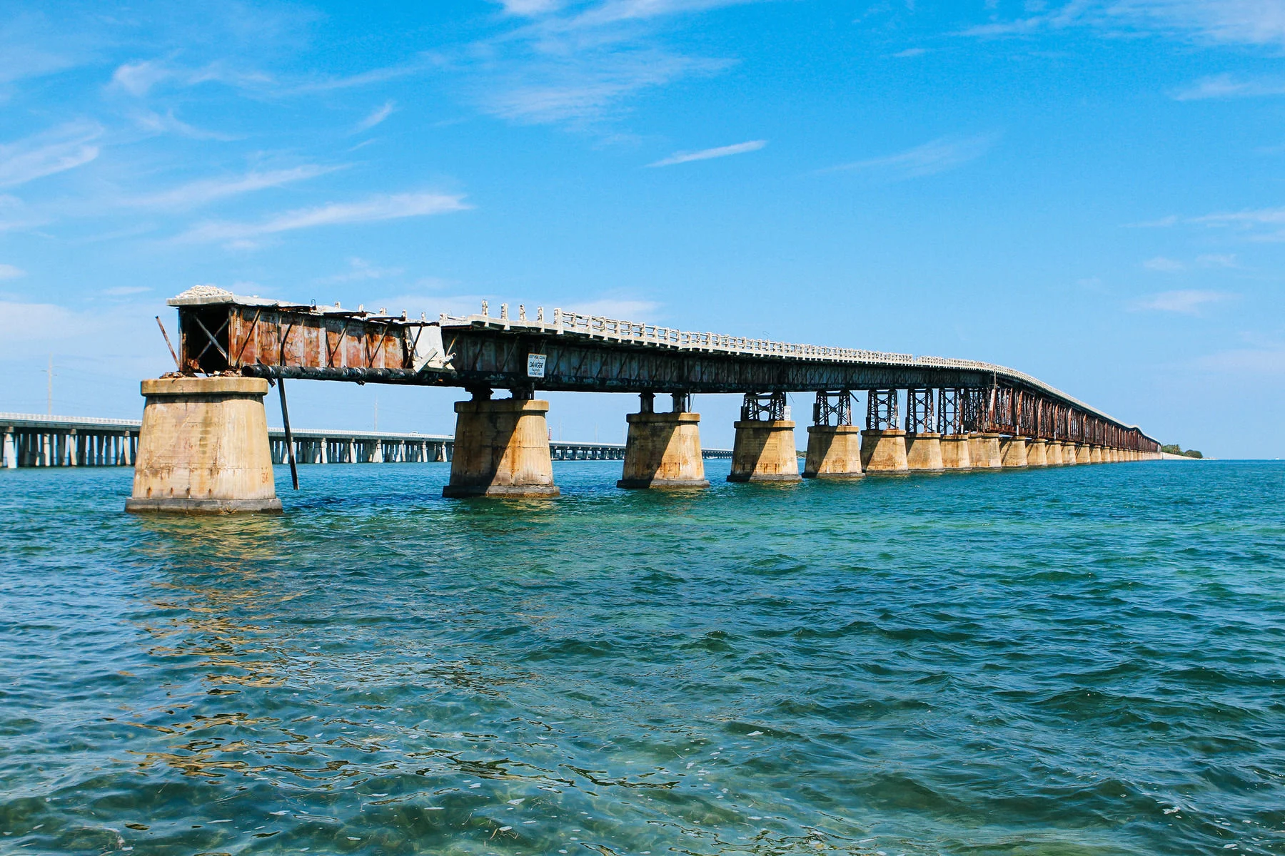  On Labor Day in 1935, the Florida Keys were devastated by the most powerful storm to ever make landfall on the United States in recorded history. The railway neighboring the Overseas Highway was never rebuilt, and its rusted skeleton accompanies mos