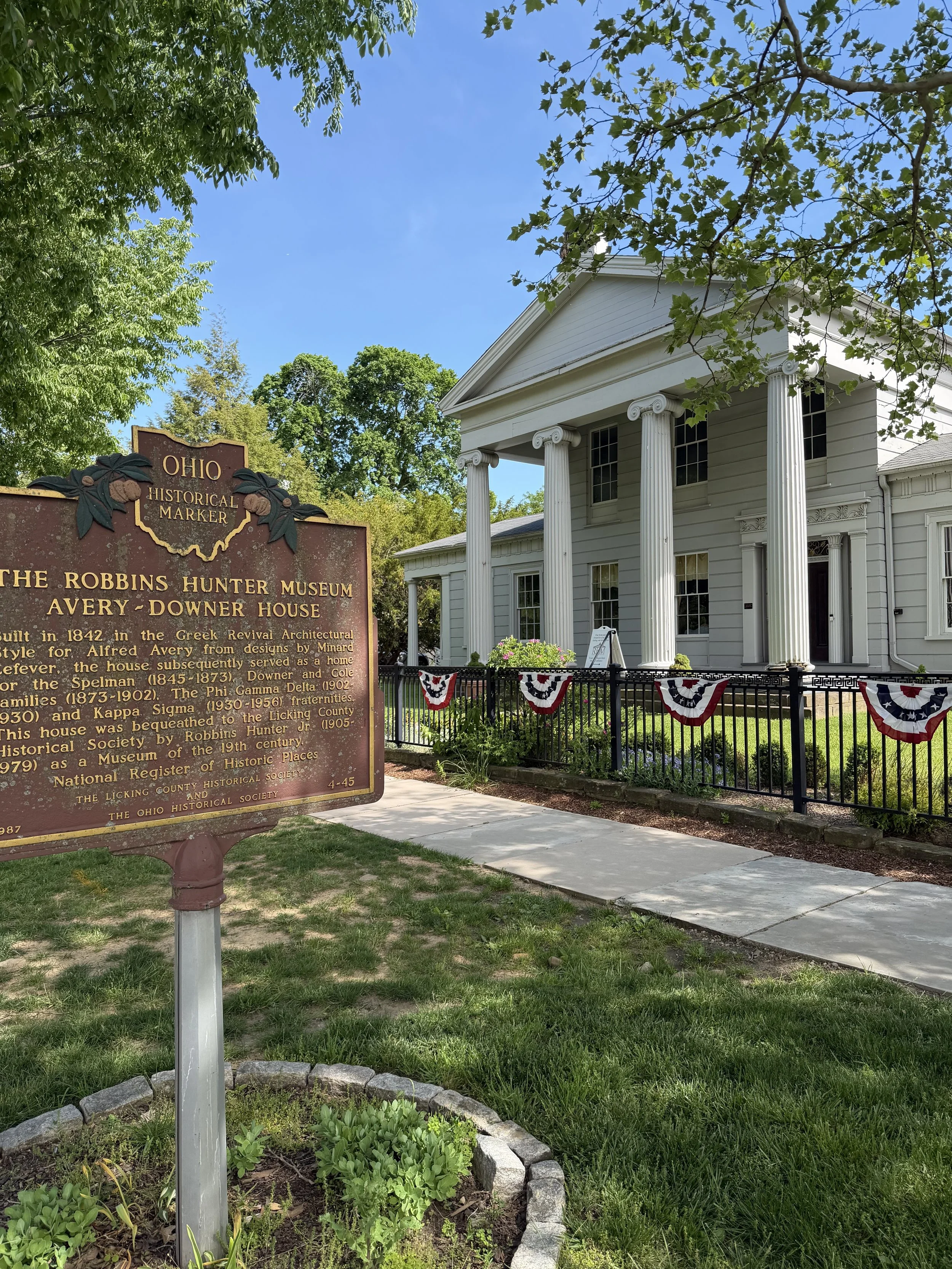 RHM front with sign with red white blue banners.jpg