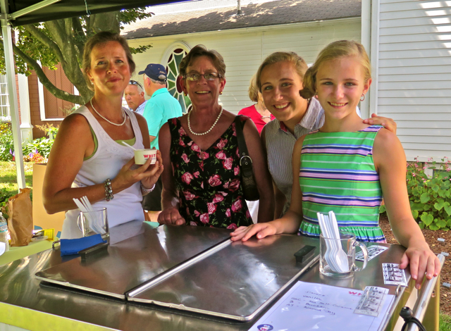 The Whit’s gals, Teri Niedermeyer, Christina Gray (board member), Alexa Minton, and Ava Minton, standing ready to pass out custard on what was a very warm day during the dedication ceremony.
