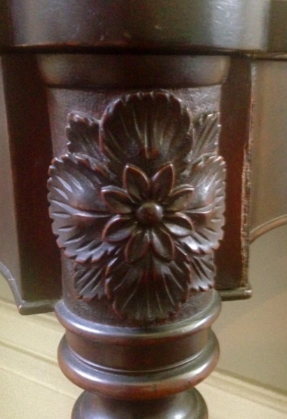 Carved flower and foliage, a signature of the McIntire workshop.