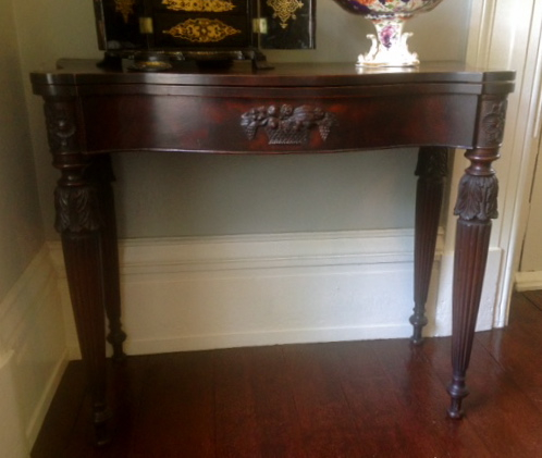 McIntire Table: One of a pair of mahogany card tables attributed to Samuel McIntire. Collection of Robbins Hunter Museum.