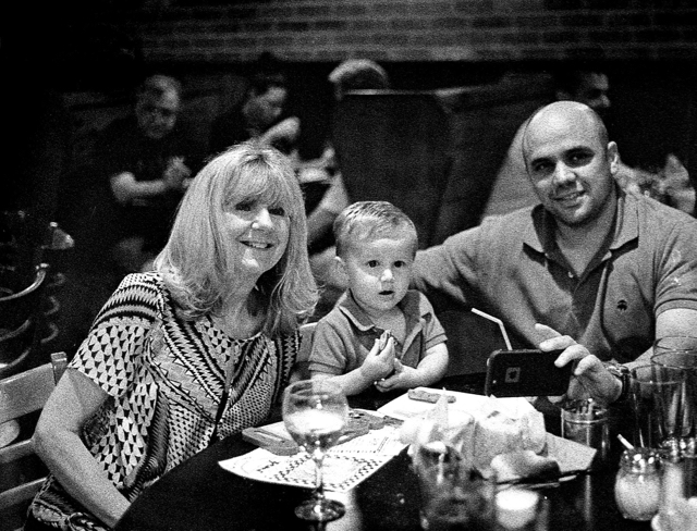 Julie with her grandson Ray and his dad, Jim, at dinner on our cruise from this past April.