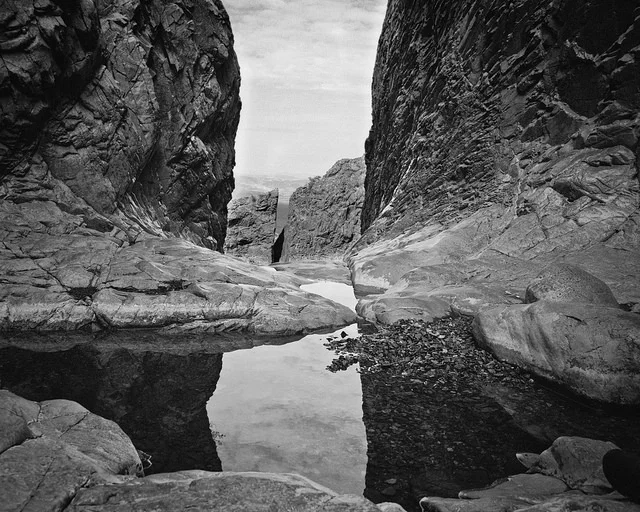 The view though the window. A shortish hike from the Chisos Basin visitor's center. Mamiya RZ67, Kodak Tri-x film.