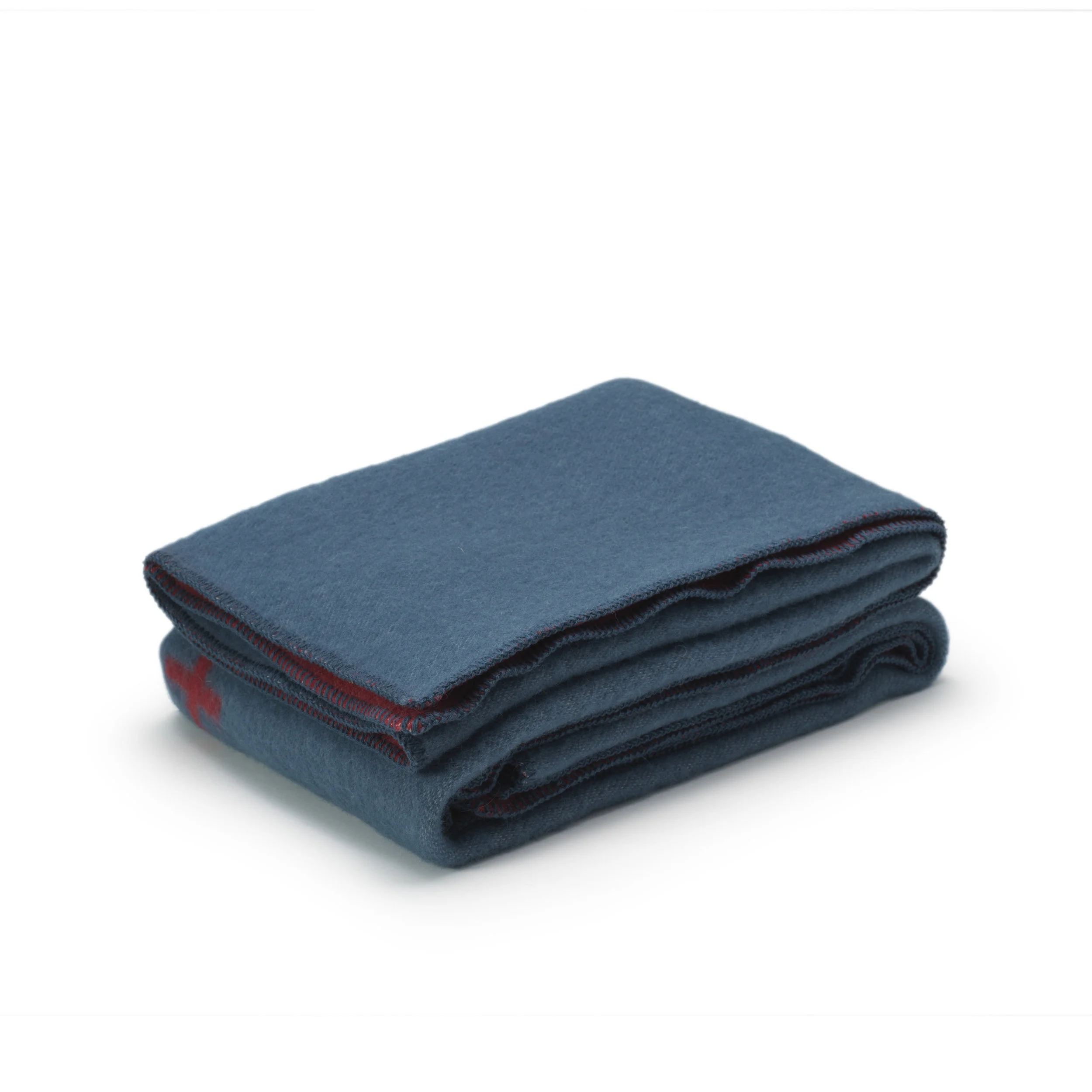 Folded wool blanket in the Plus design.