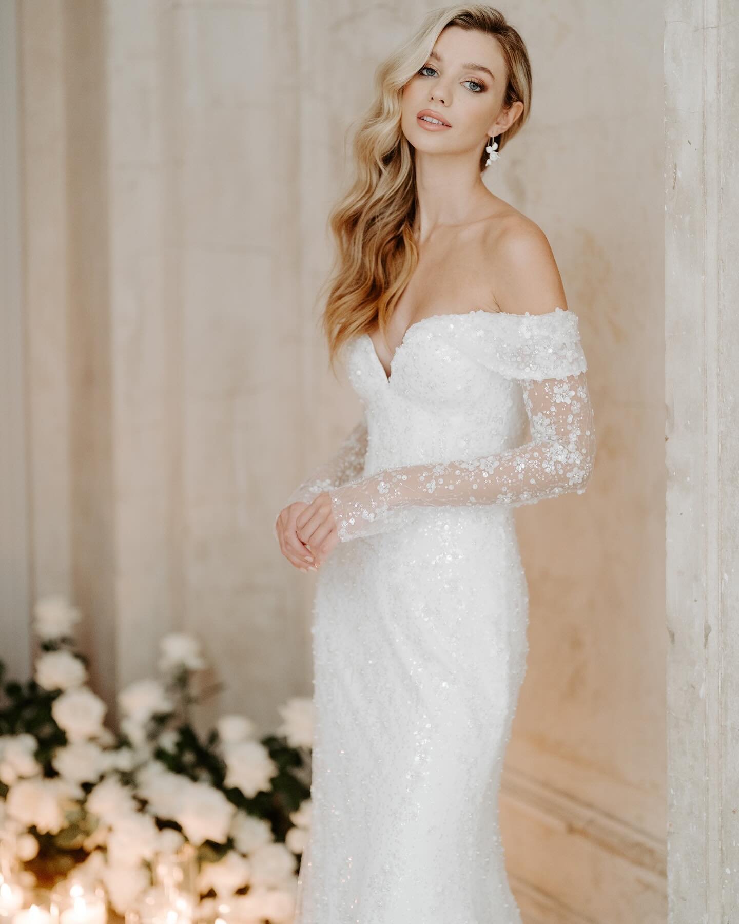 EXCELSIOR 🤍 Striking off the shoulder beaded tulle gown with corseted bodice and long sleeves, v-back and a softly fitted skirt. Timeless glamour by Suzanne Neville London, exclusive to HRB