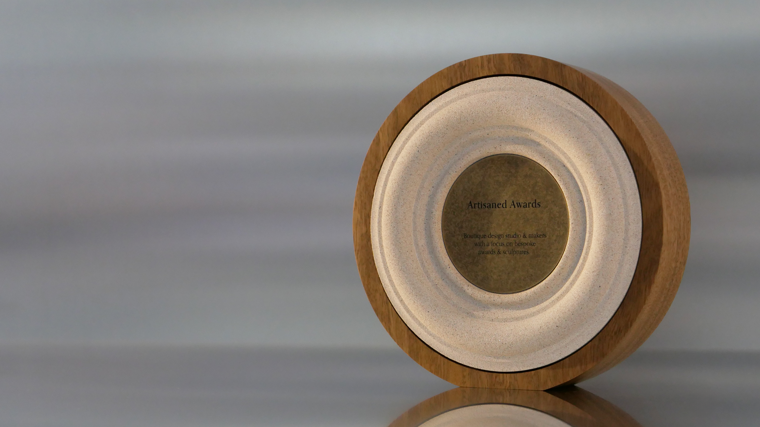 Baroque core design, light hardwood surround, sand core finish & aged brass plaque.