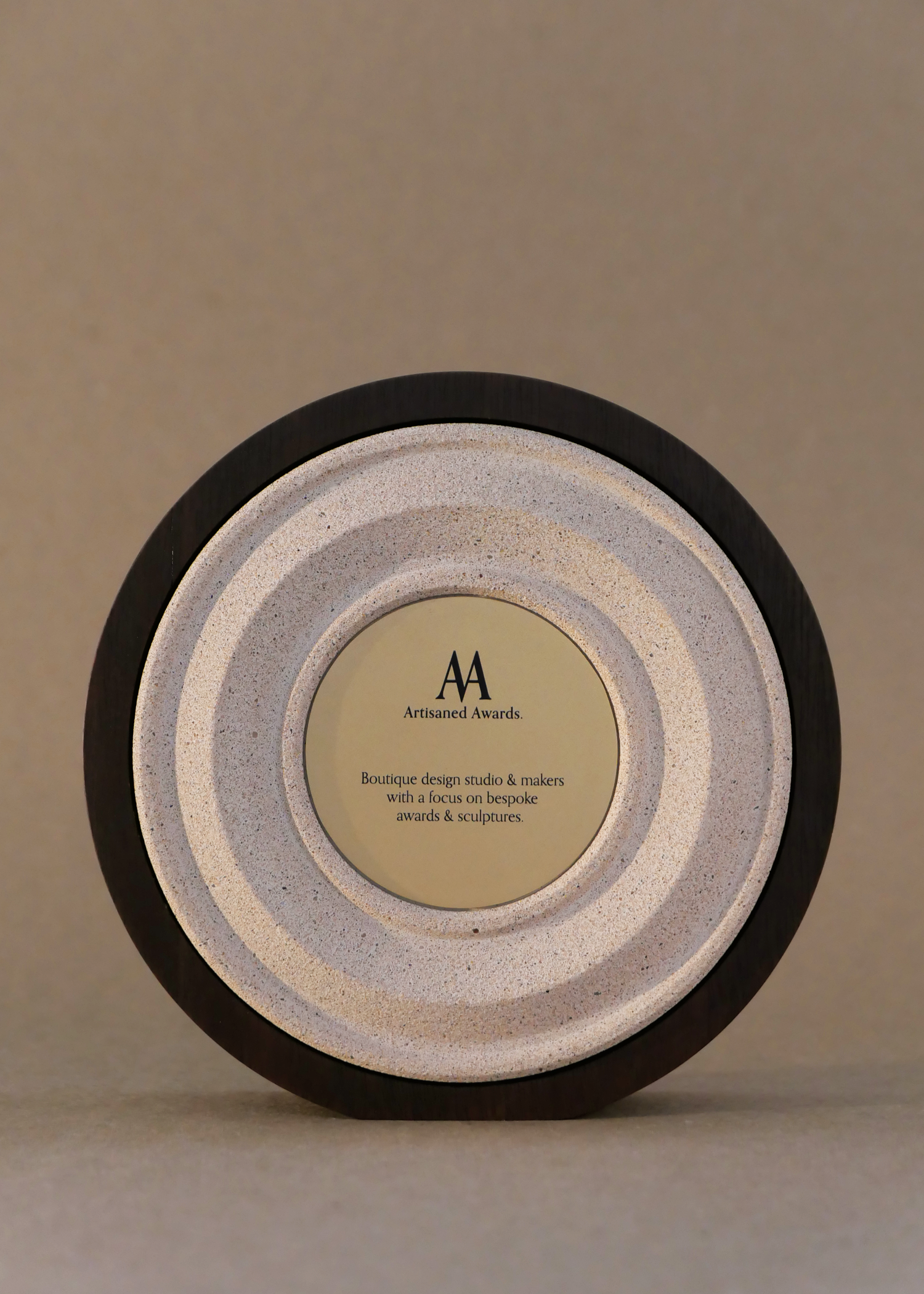 Amphi core design, dark hardwood surround, terracotta light core finish & bead blasted brass plaque.