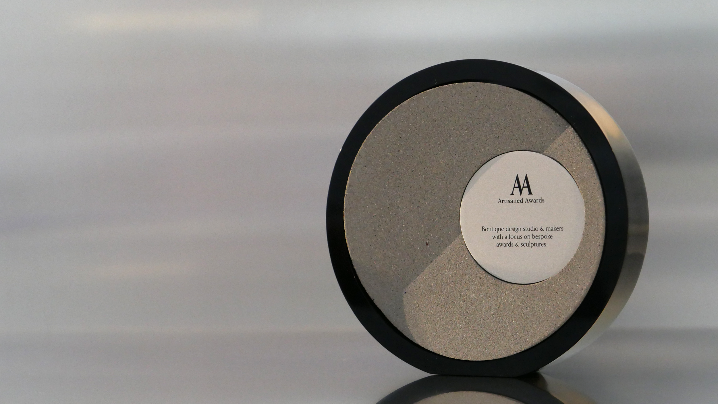 Fold core design, black gloss acrylic surround, warm grey core finish & bead blasted aluminium plaque.