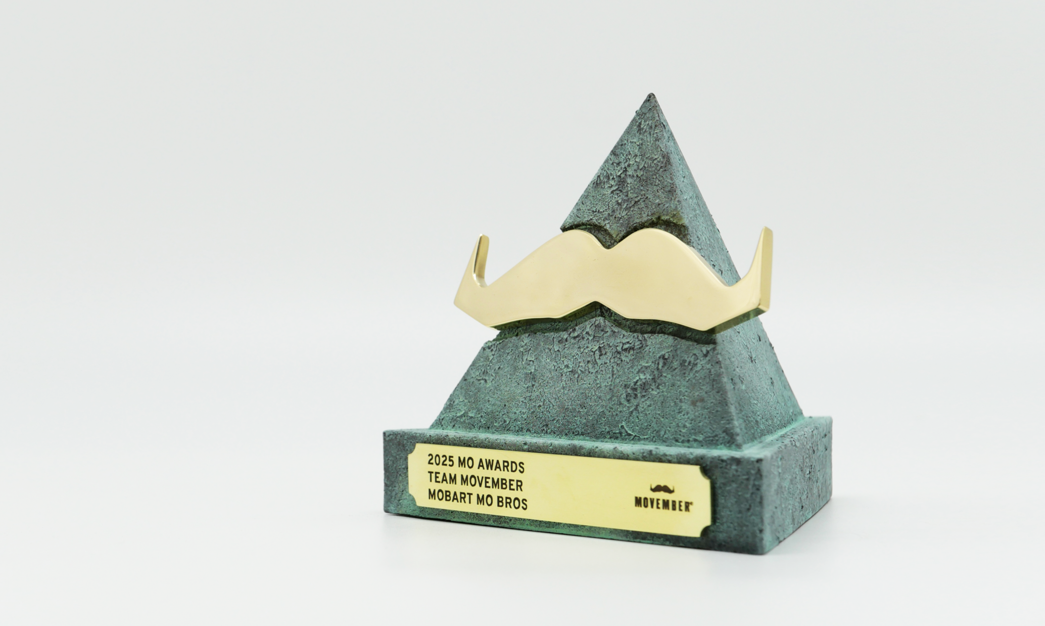 Custom cast material body with hand painted finish and patina. Machined brass mo with hand polished finish and custom artwork + text laser etched plaque. Bespoke Trophy, Award, Plaque, Memento or sculpture by Artisaned Awards.