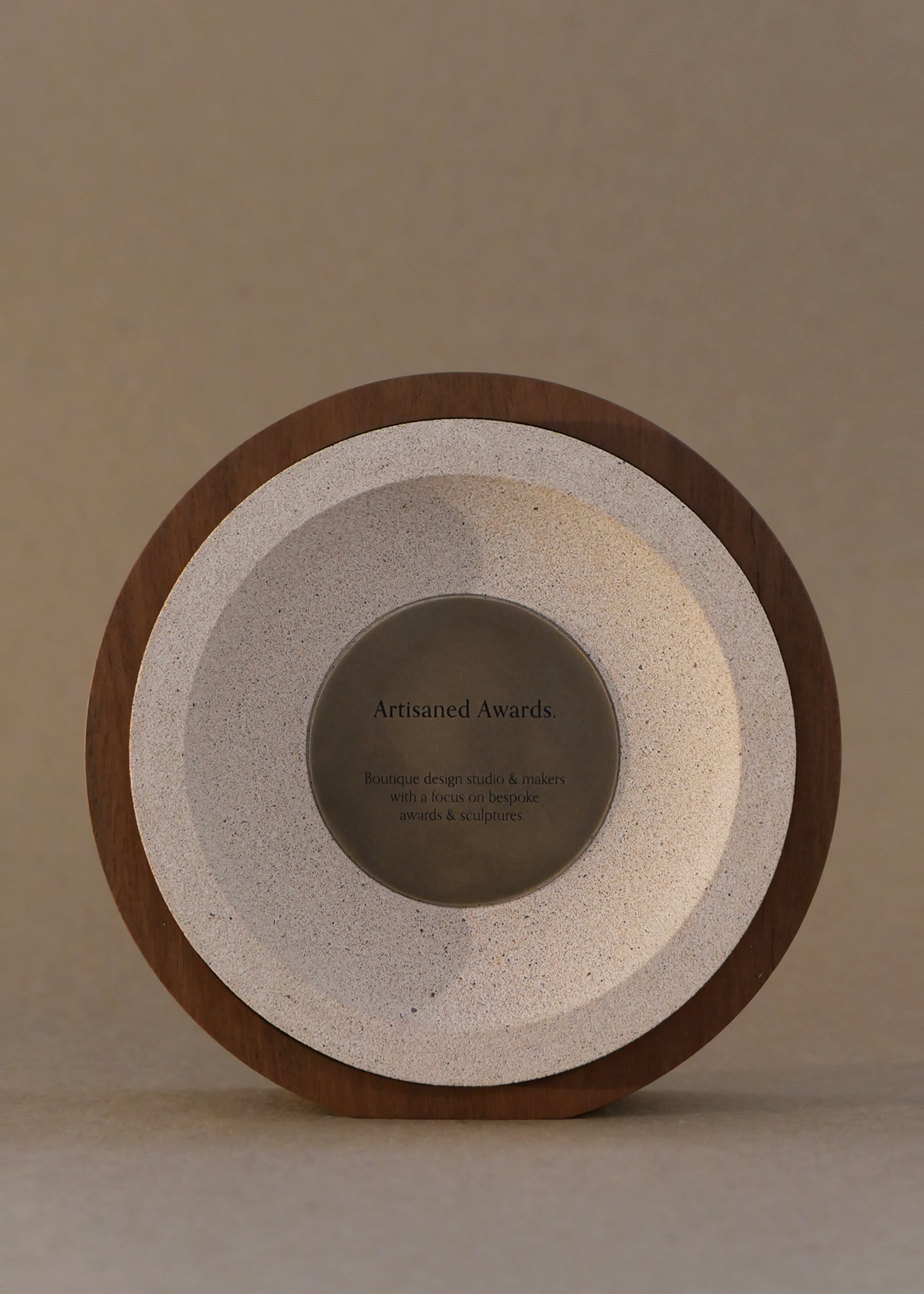 Sphere core design, light hardwood surround, terracotta light core finish & blackened brass plaque.