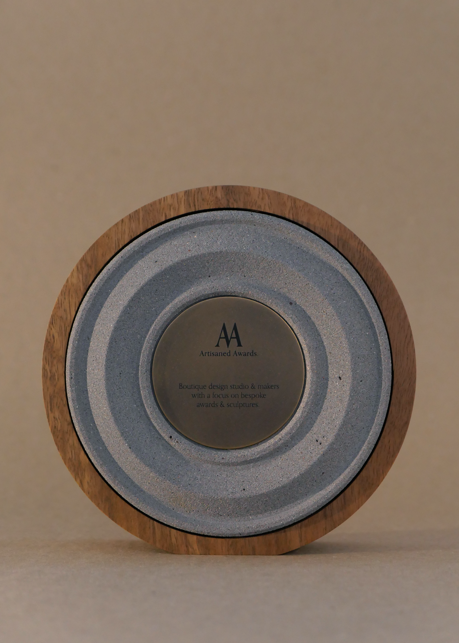 Amphi core design, light hardwood surround, warm grey core finish & blackened brass plaque.