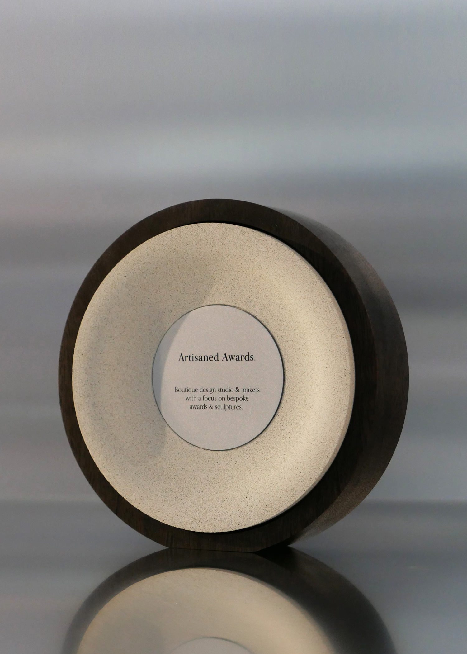 Arc award design, dark hardwood surround, beige core finish & bead blasted aluminium plaque.