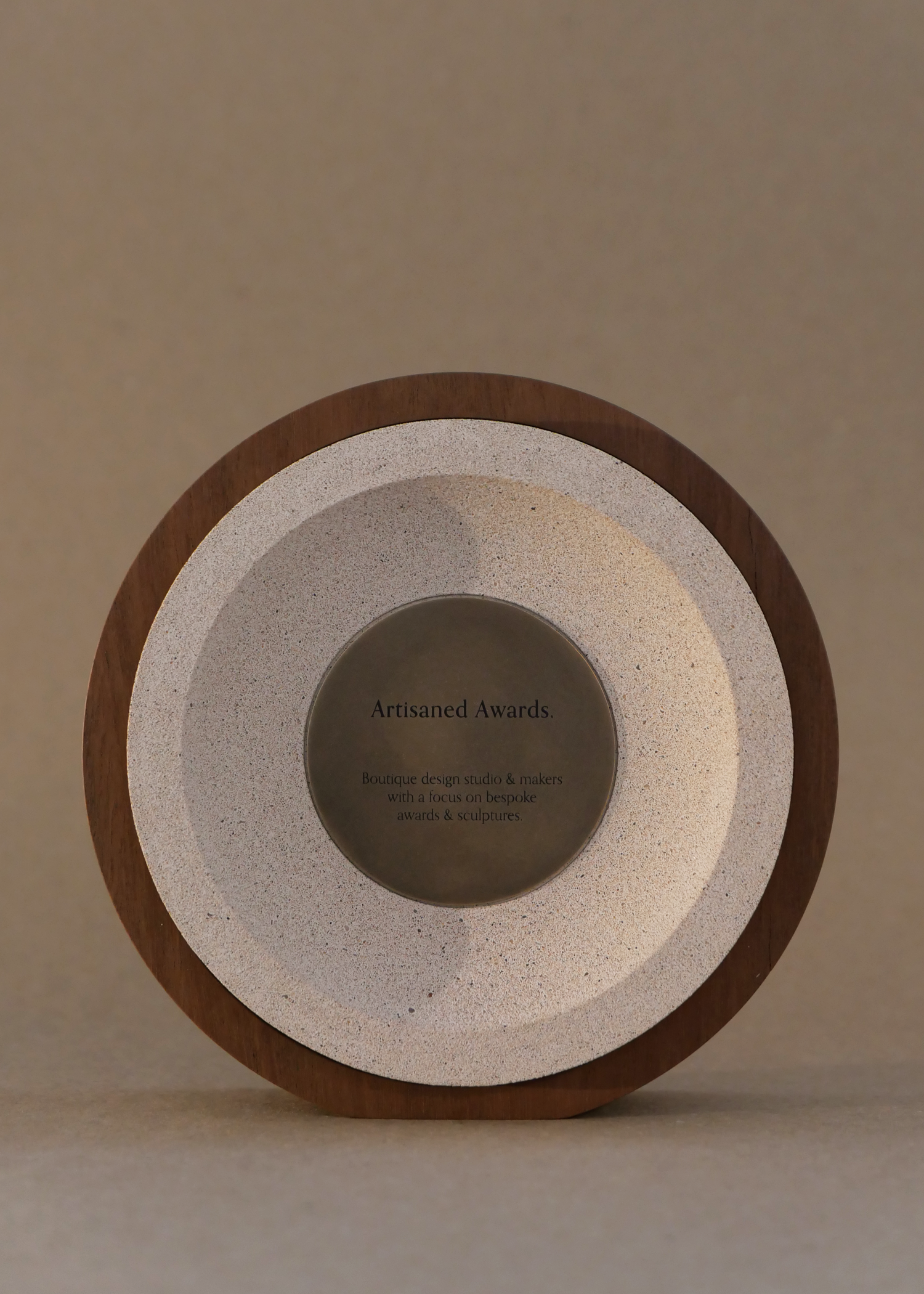 Sphere award design, light hardwood surround, terracotta light core finish & blackened brass plaque.