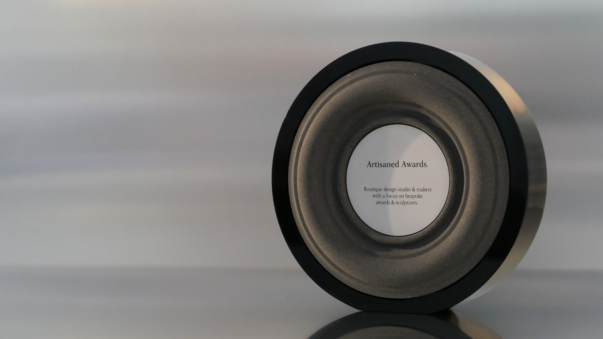 Baroque core design, black gloss acrylic surround, charcoal core finish & bead blasted aluminium plaque.