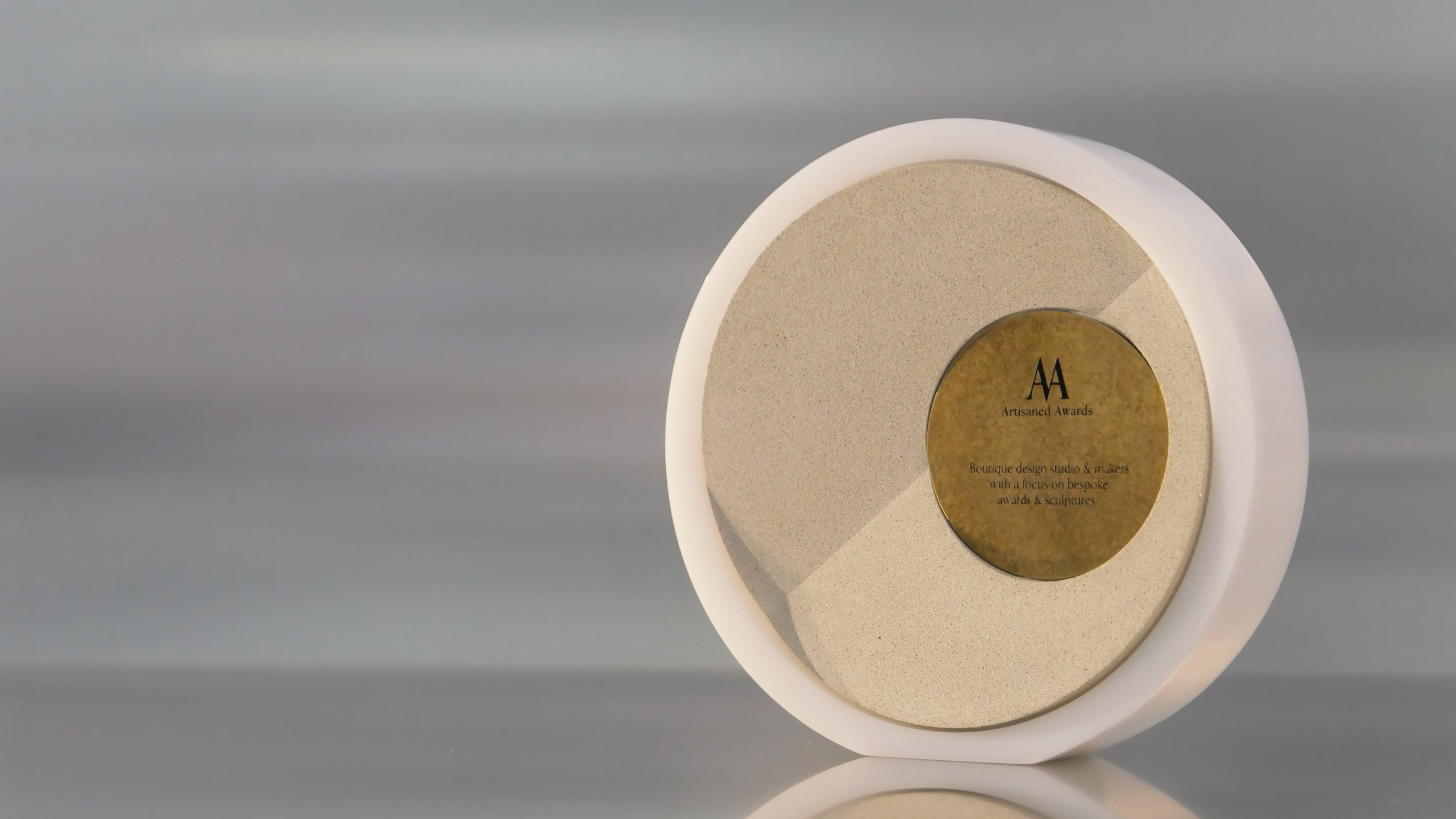 Fold core design, white gloss acrylic surround, beige core finish & aged brass plaque.