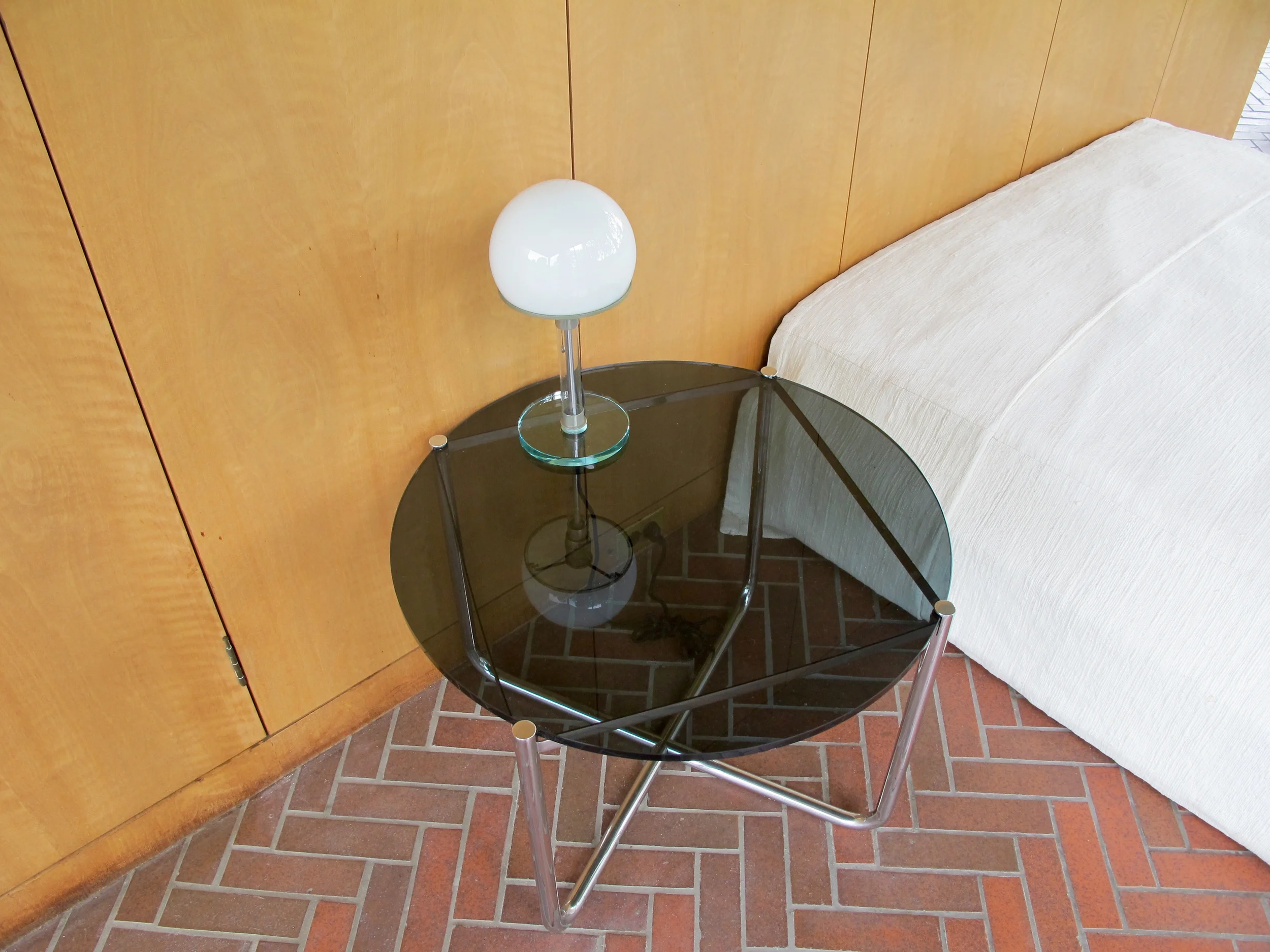 Bedroom: Wilhelm Wagenfeld and Carl Jacob Jucker Bauhaus lamp, 1924; Ludwig Mies van der Rohe Low table, 1927