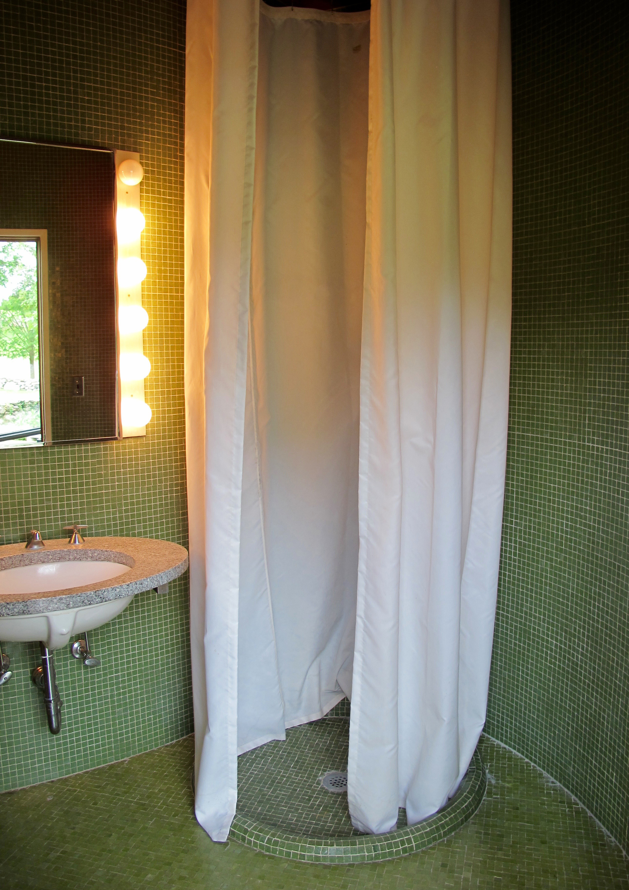 Bathroom: Turn the corner from the fireplace and this small but sparse room shares space in that same column in the middle of the house. Loved the tile.