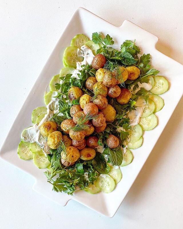 My version of potato salad 😉 Except deconstruct it and make it summery☀️🥔🥒 &mdash; crispy creamer taters, on a bed of fresh herbs (dill, mint, cilantro, and parsley), chilled cucumbers, with a lemony sour cream dressing. Healthy, refreshing, and s