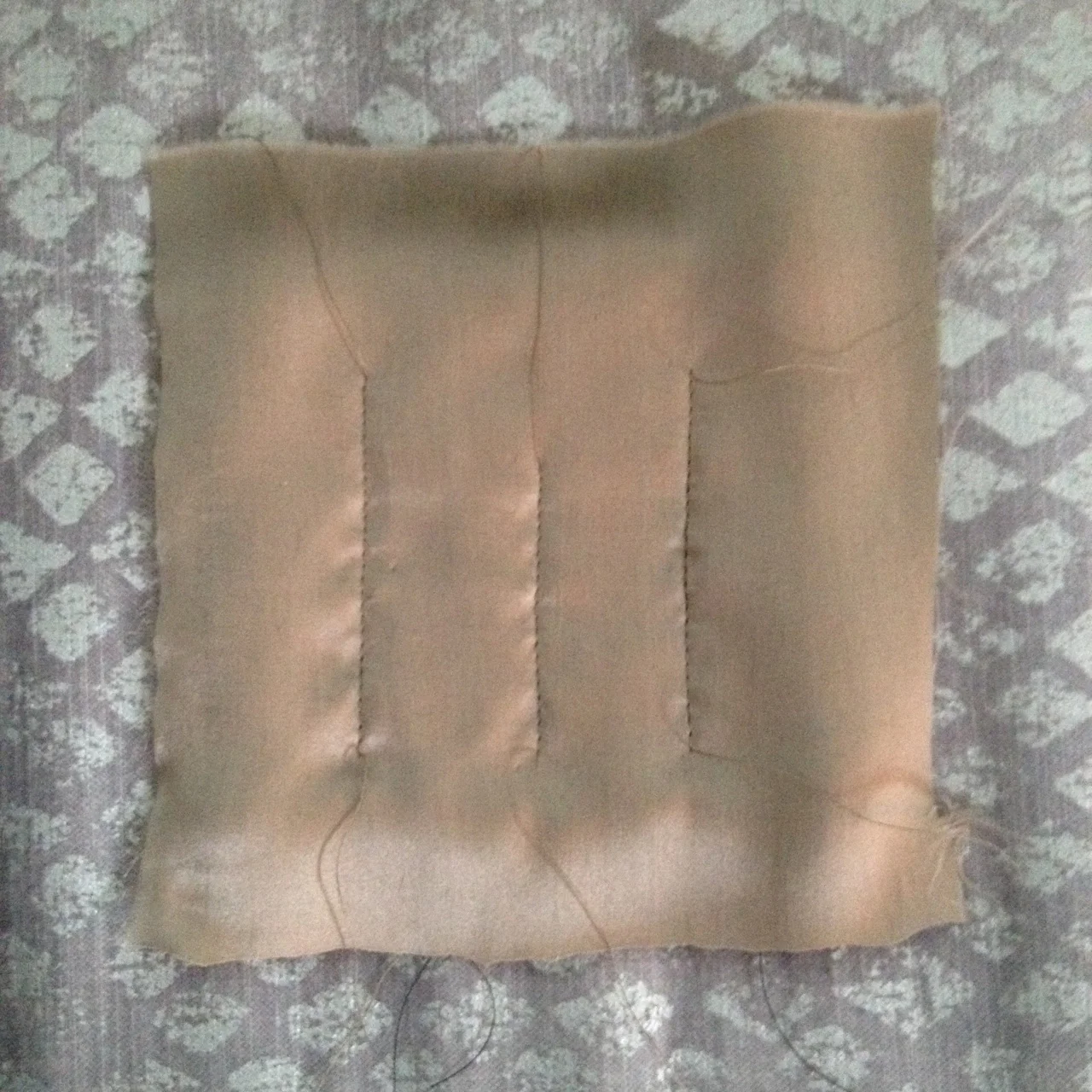 5. Stitch quilting lines in place between pins (no back stitching).