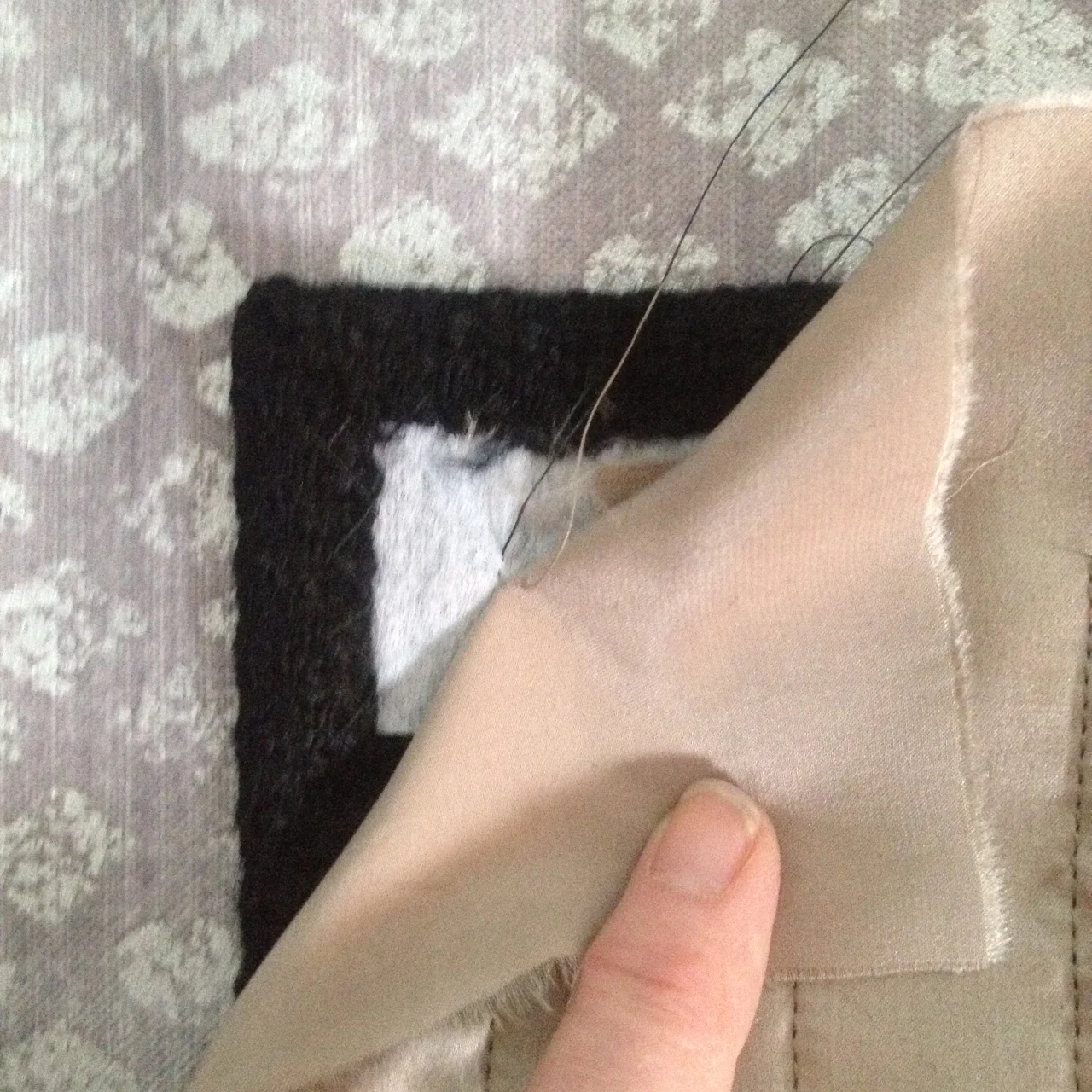 6. Pull thread ends to inside between lining and pocket.